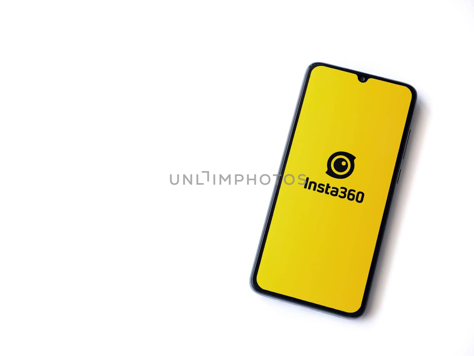 Lod, Israel - July 16,2023: Insta360 app launch screen on smartphone on white background.. Top view flat lay with copy space.