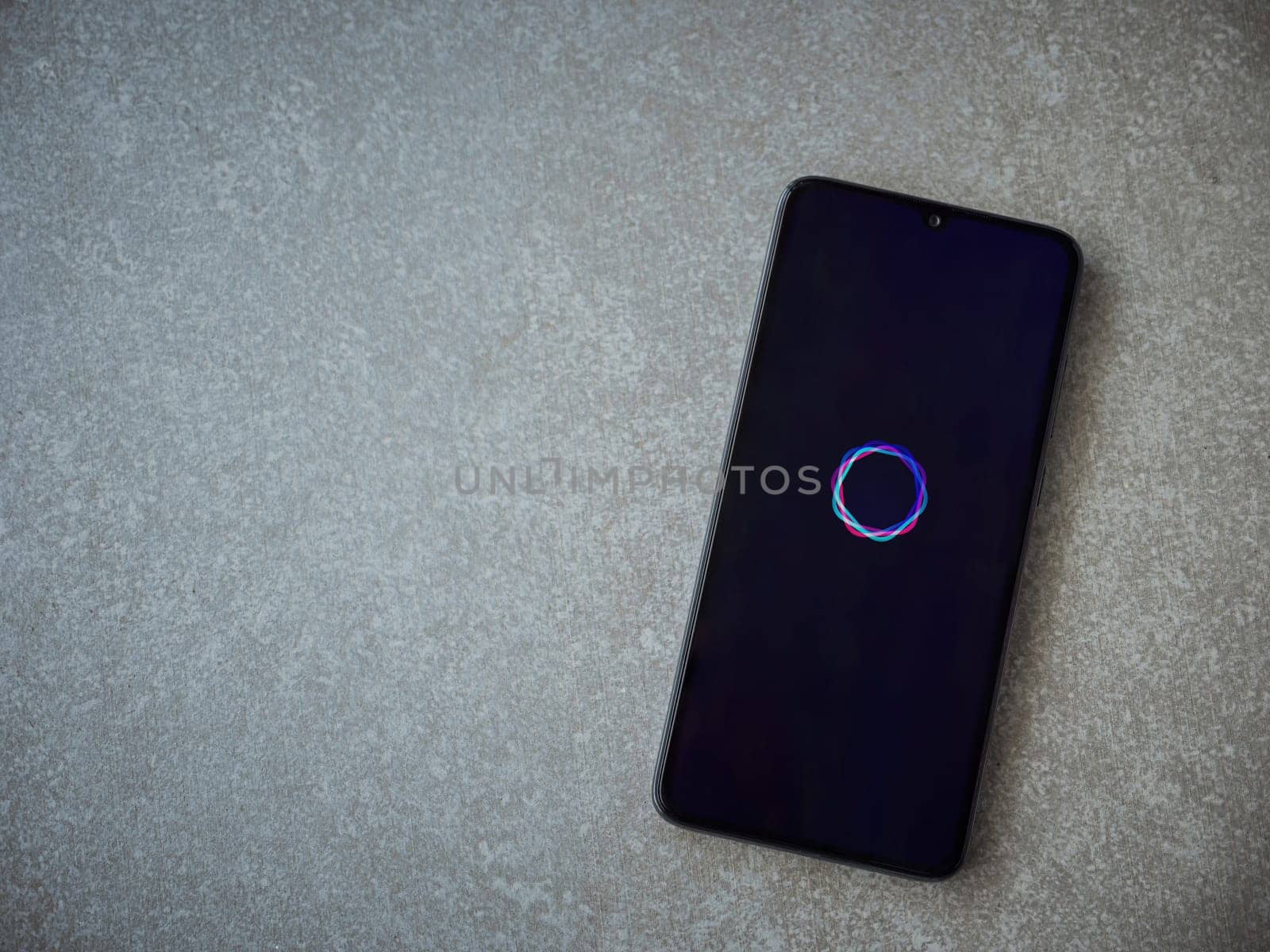 Lod, Israel - July 16,2023: Imagine - AI Art Generator app launch screen on smartphone on ceramic stone background. Top view flat lay with copy space.