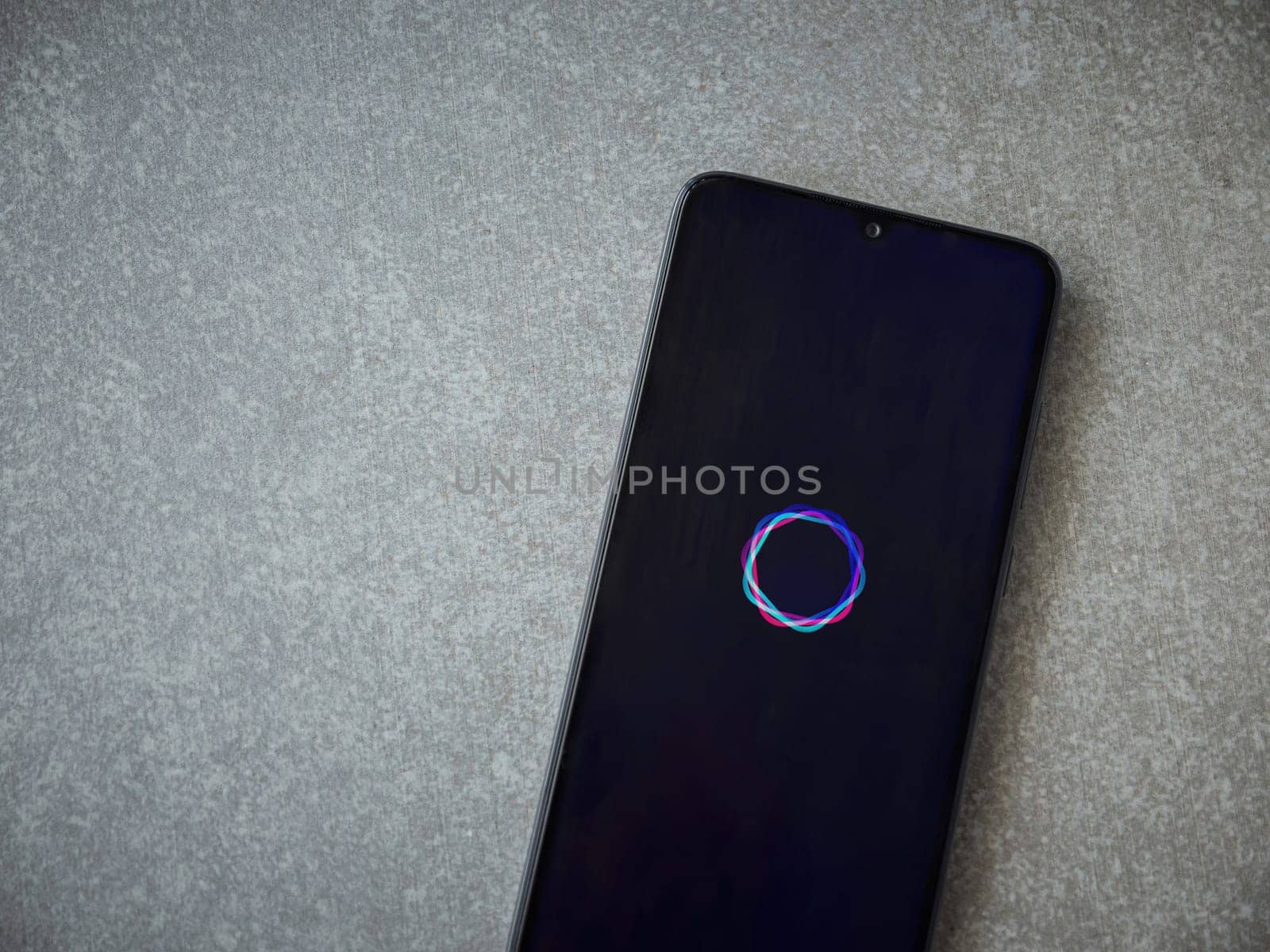 Lod, Israel - July 16,2023: Imagine - AI Art Generator app launch screen on smartphone on ceramic stone background.. Top view flat lay with copy space.