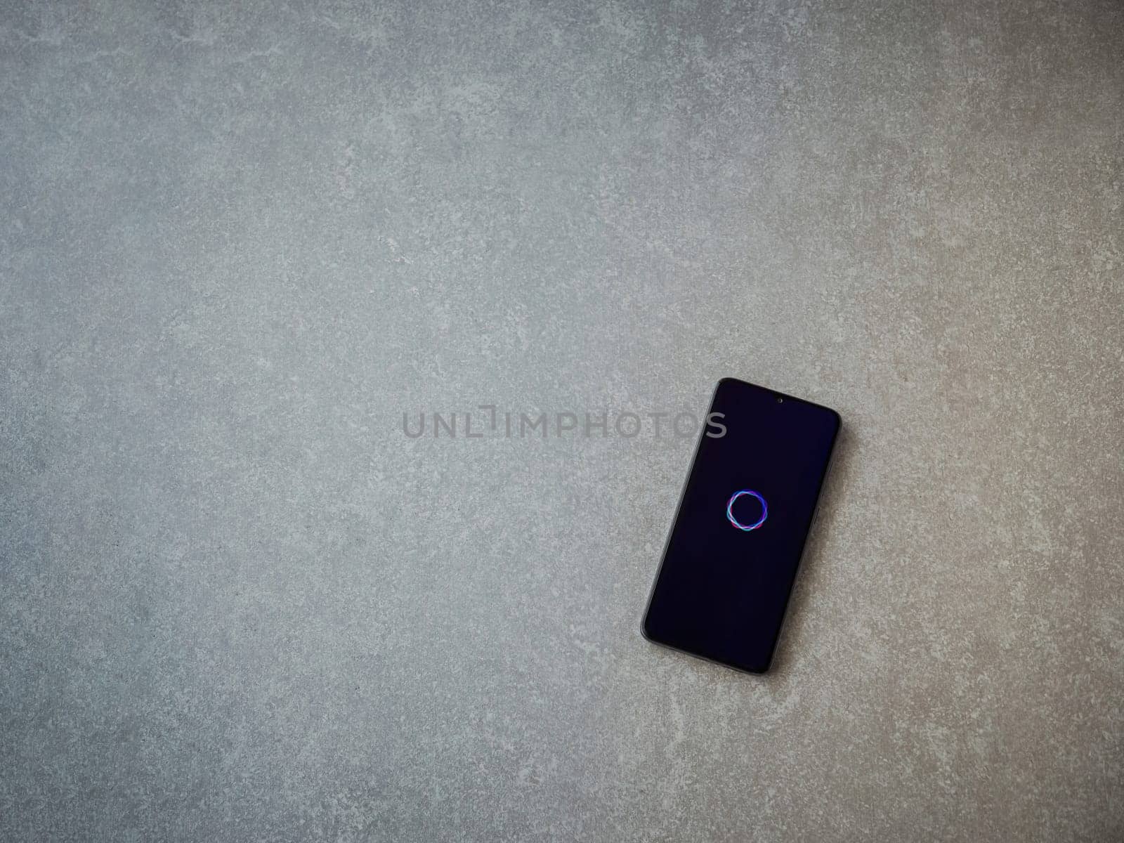Lod, Israel - July 16,2023: Imagine - AI Art Generator app launch screen on smartphone on ceramic stone background.. Top view flat lay with copy space.