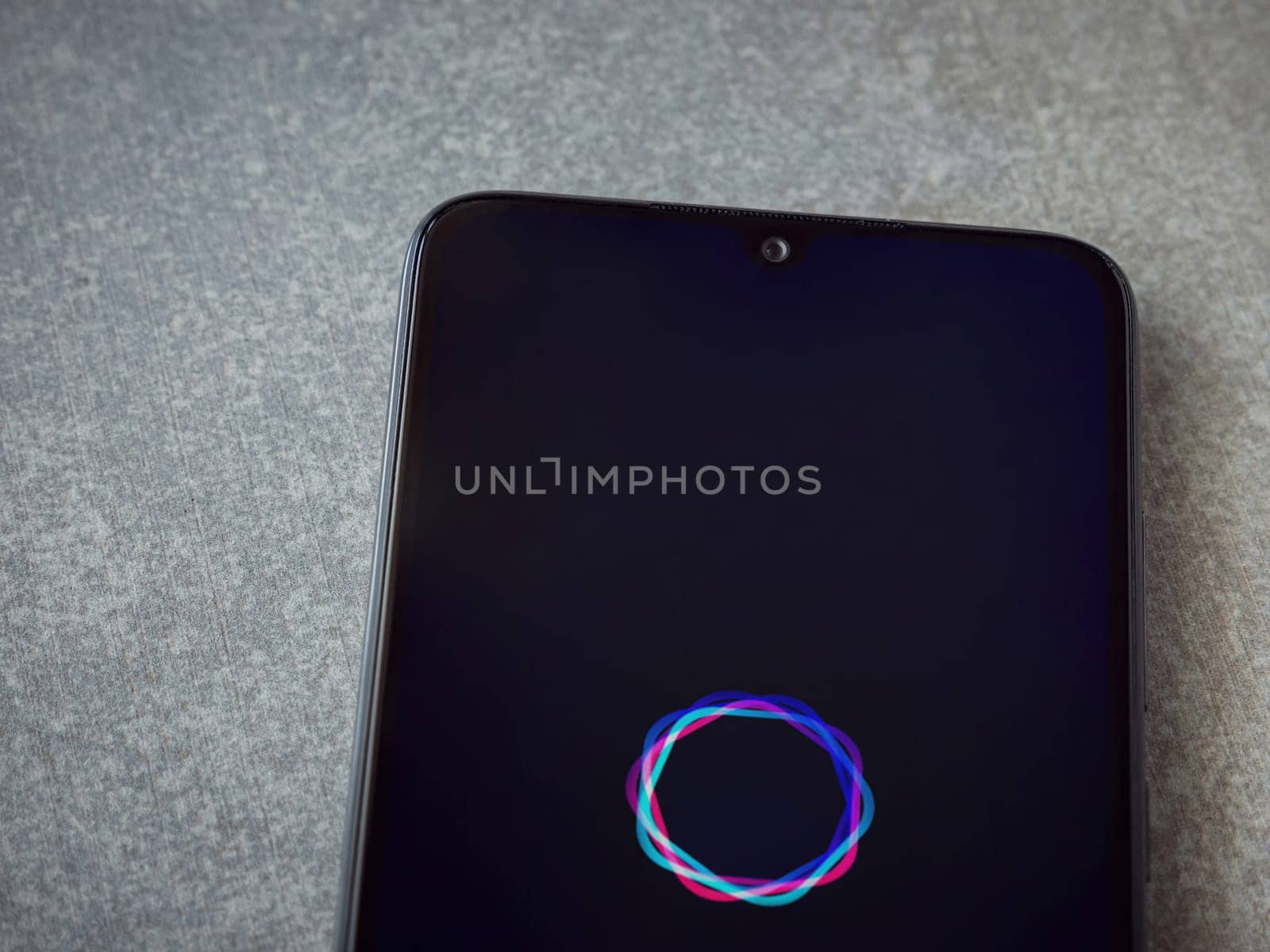 Lod, Israel - July 16,2023: Imagine - AI Art Generator app launch screen on smartphone on ceramic stone background.. Top view flat lay with copy space.