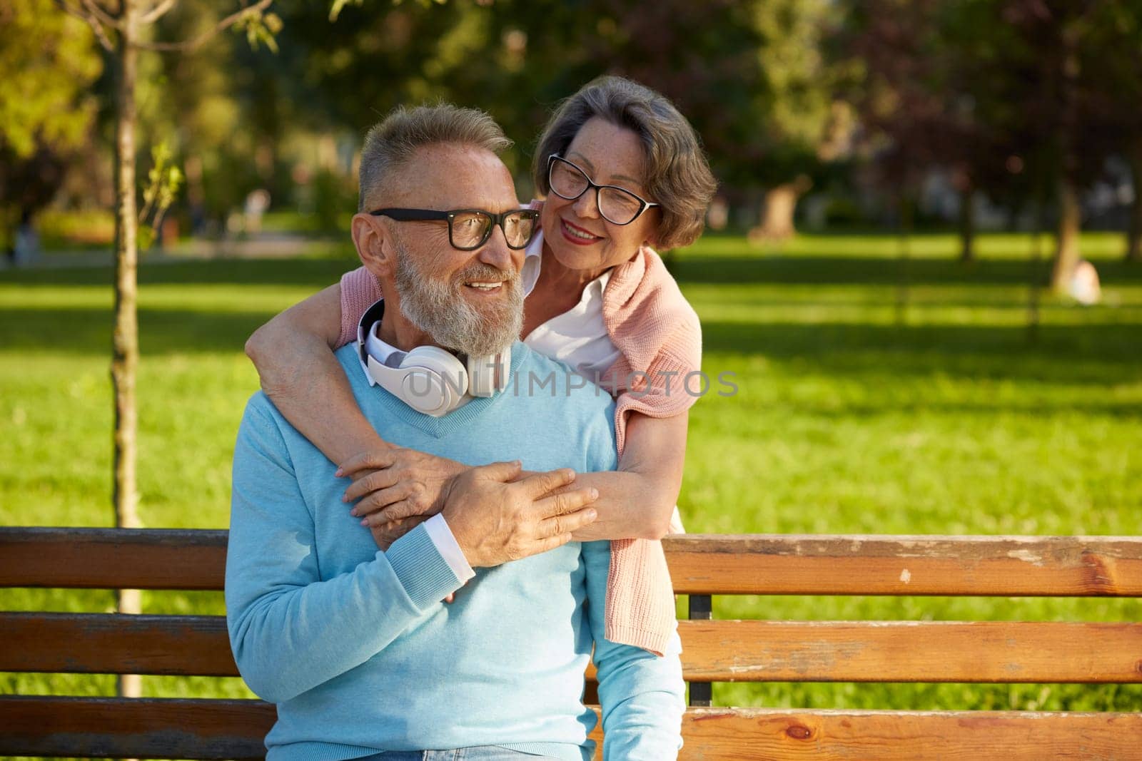 Portrait of married senior couple in hug with love feeling happiness, bonding and romance showing smile on shiny faces