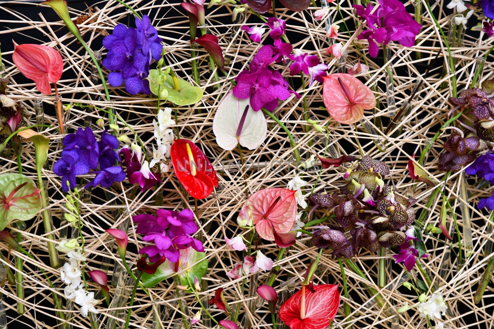 Straw wall with many different flowers
