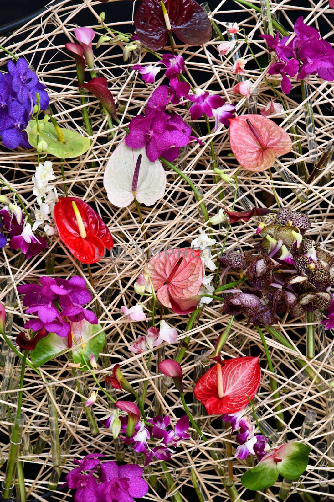 Straw wall with many different flowers