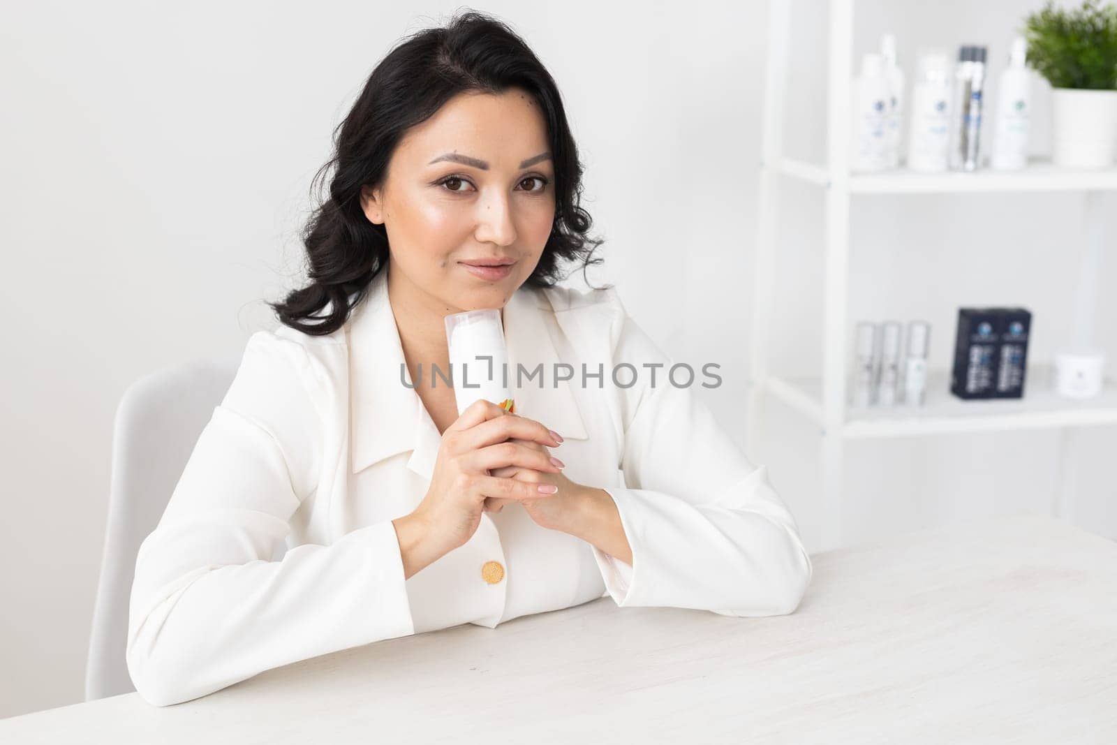 Beautician in the cosmetology office. Cosmetologist doctor dermatologist in a beauty clinic. Facial skin treatment. Beauty treatments.