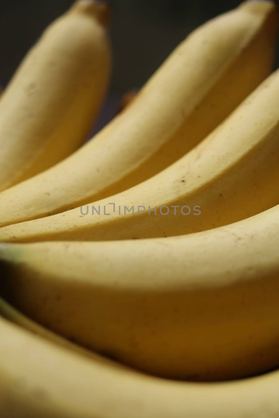 Banana fruit with wooden table on blurred background