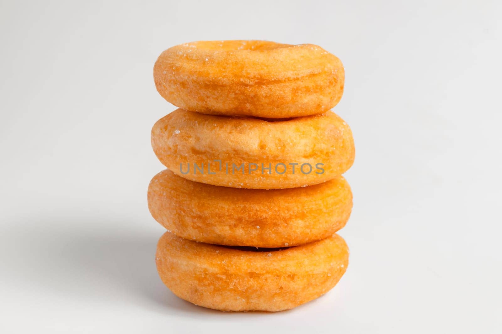 Donuts cake bakery sprinkled with sugar on white background