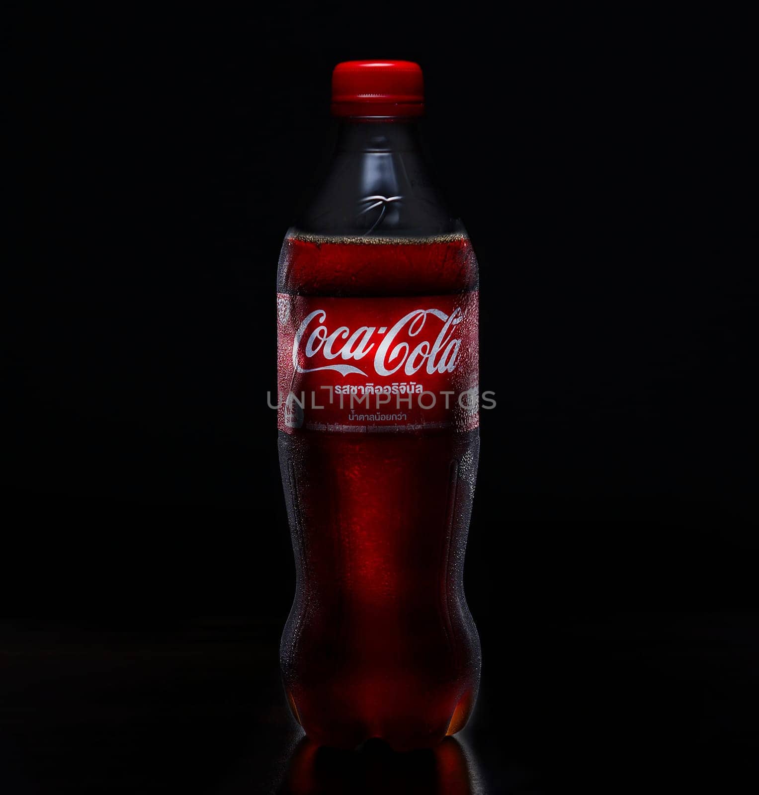 PHUKET, THAILAND - SEP 25, 2023: Coca Cola, a sweet and fizzy soft drink that is popular all over the world, Dark blurred background