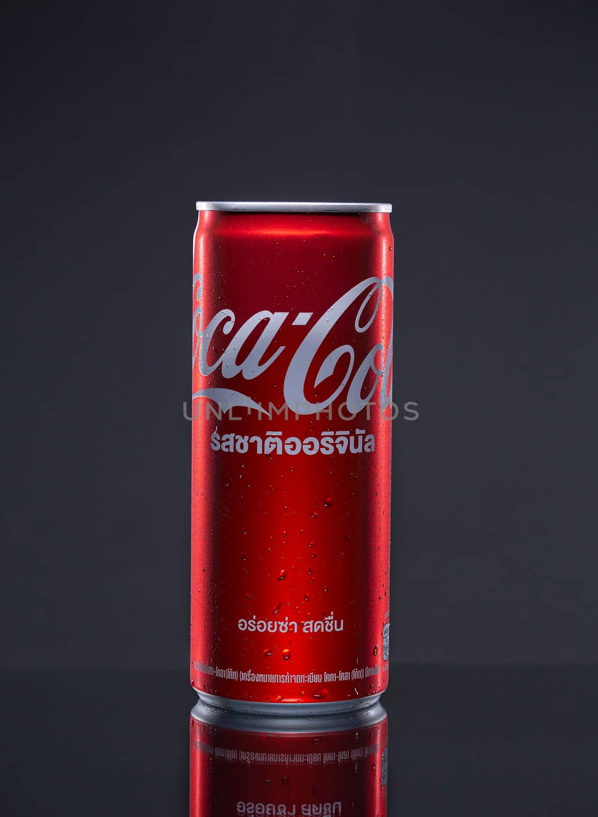PHUKET, THAILAND - SEP. 30, 2023: Coca Cola, Can sweet and fizzy soft drink No sugar, No calories, that is popular all over the world, Dark blurred background
