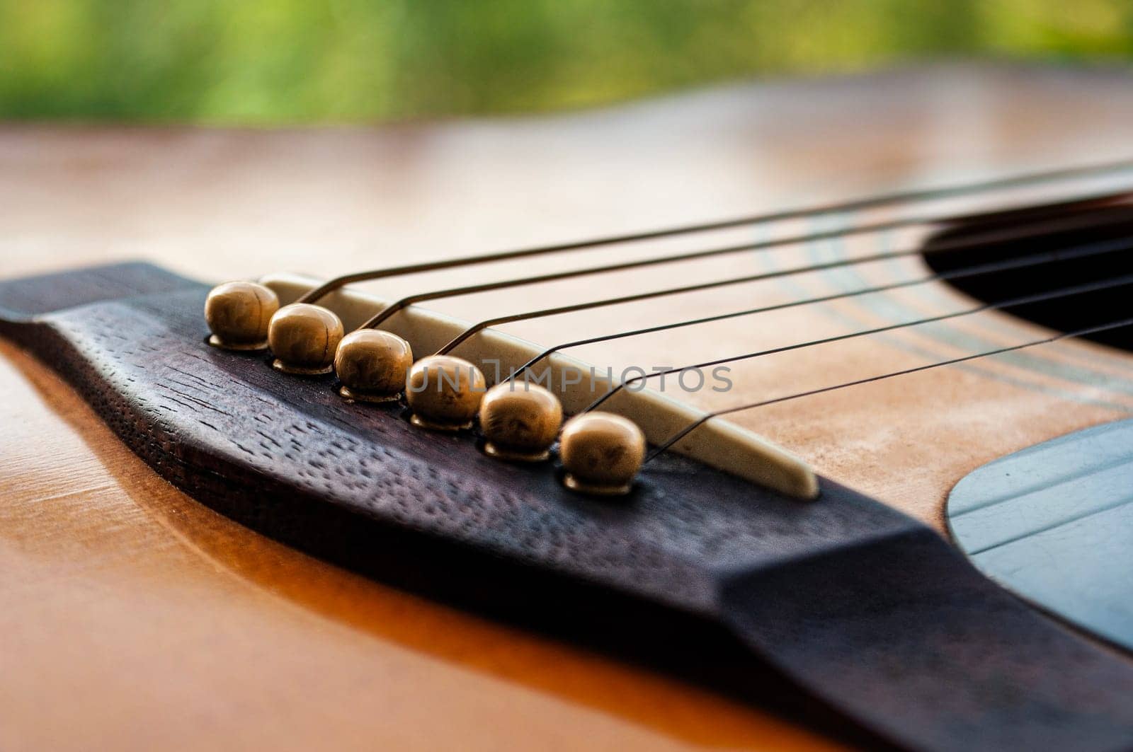 Close up of Guitar with nature background. Customizable space for text or ideas. Copy space.