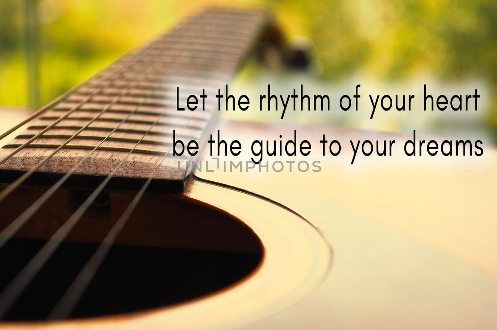Motivational and inspirational quote - Let the rhythm of your heart be the guide to your dreams.. With Guitar background