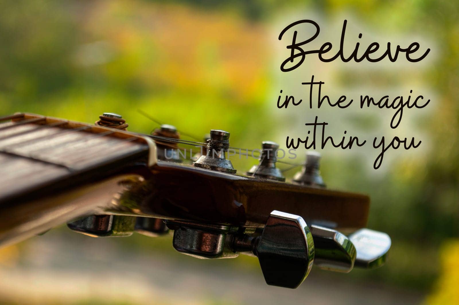 Motivational and inspirational quote - Believe in the magic within you. With Guitar background