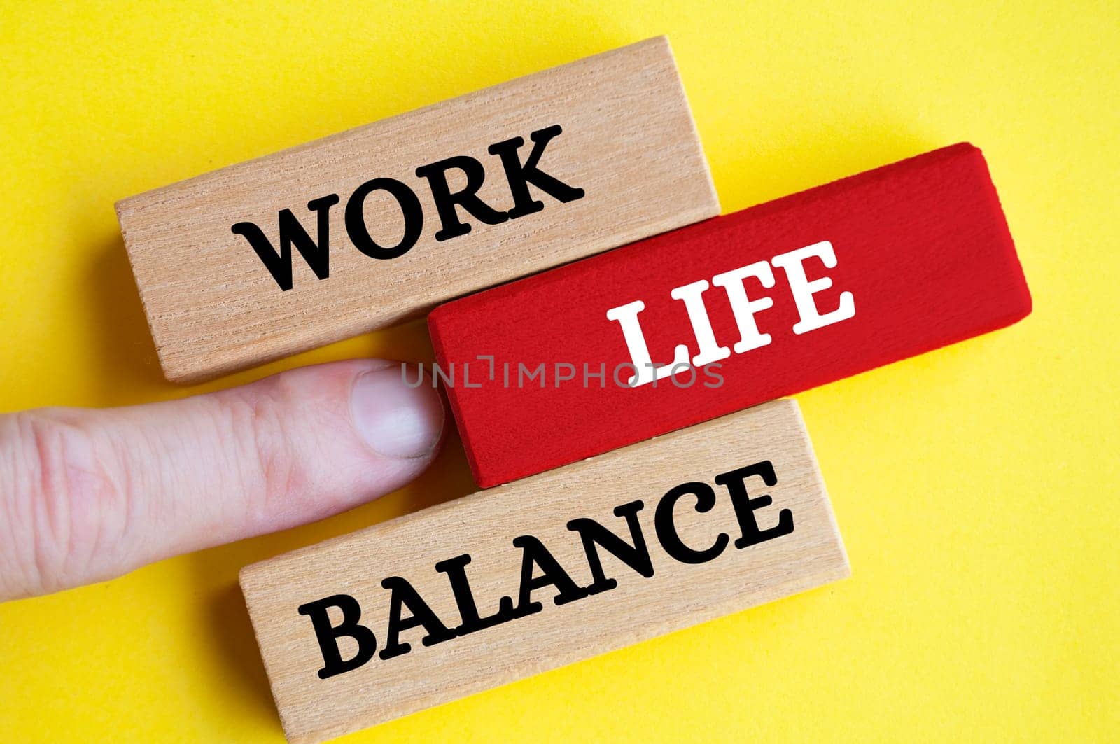 Work life balance text on wooden blocks with yellow cover background. Working culture concept.