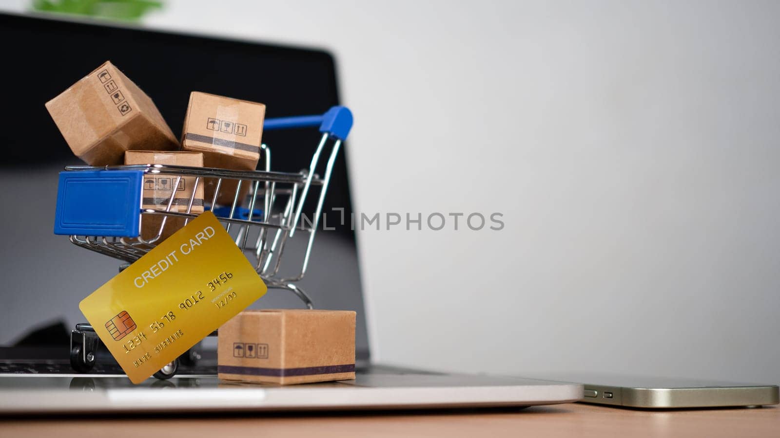 Shopping carts and credit card Place on laptop computer repressents online shopping concept, website, e-commerce, market platform, technology and online payment concept.