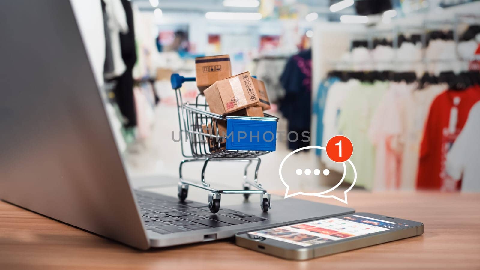 Shopping carts and product boxes Place on laptop computer showing online shopping concept, website, e-commerce, market platform, technology and online payment concept.