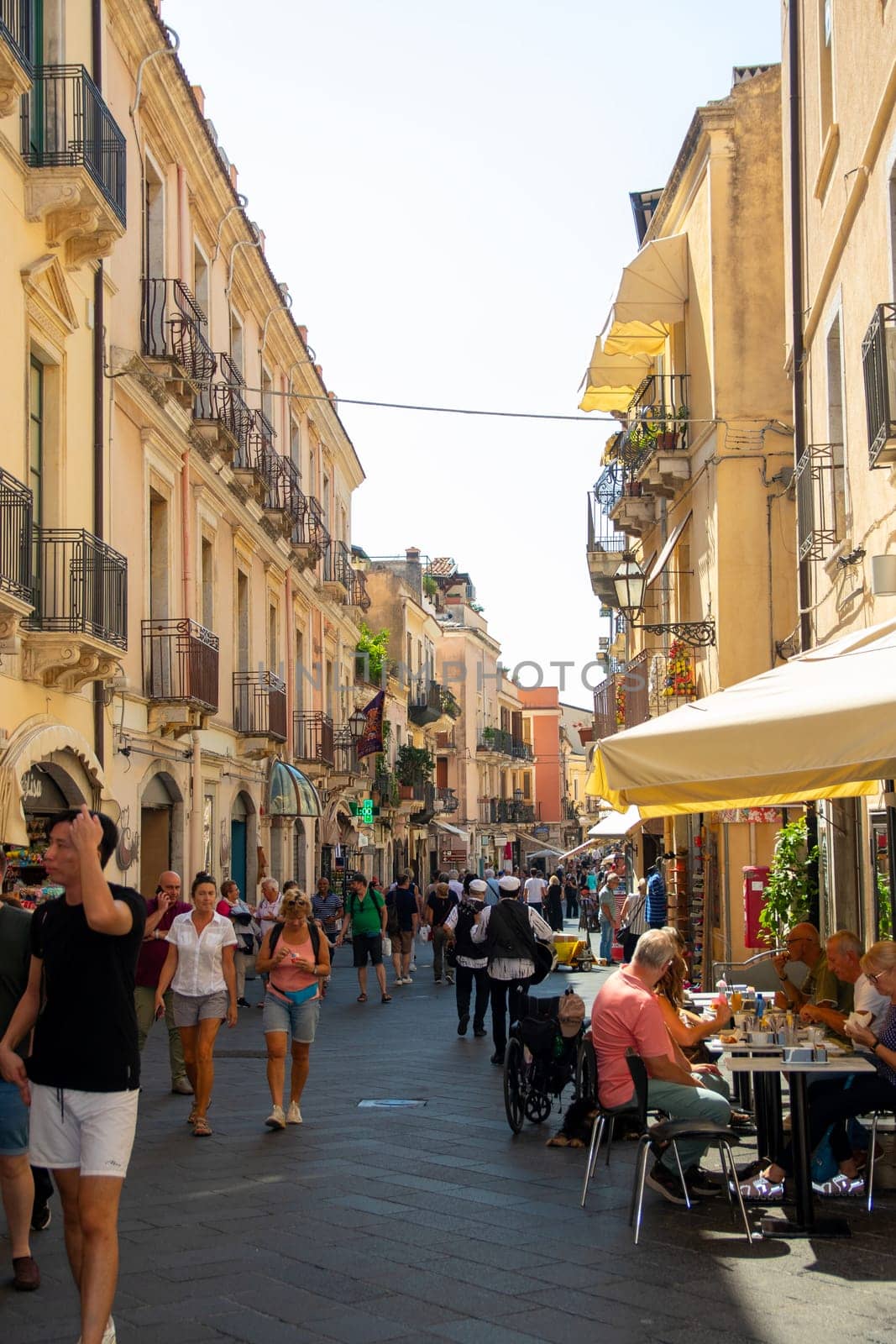 Sicily, Taormina, Italy - 28 September 2023. Tourists in the main street Corso umberto in Taormina. City views, facades, architecture and the most popular streets.