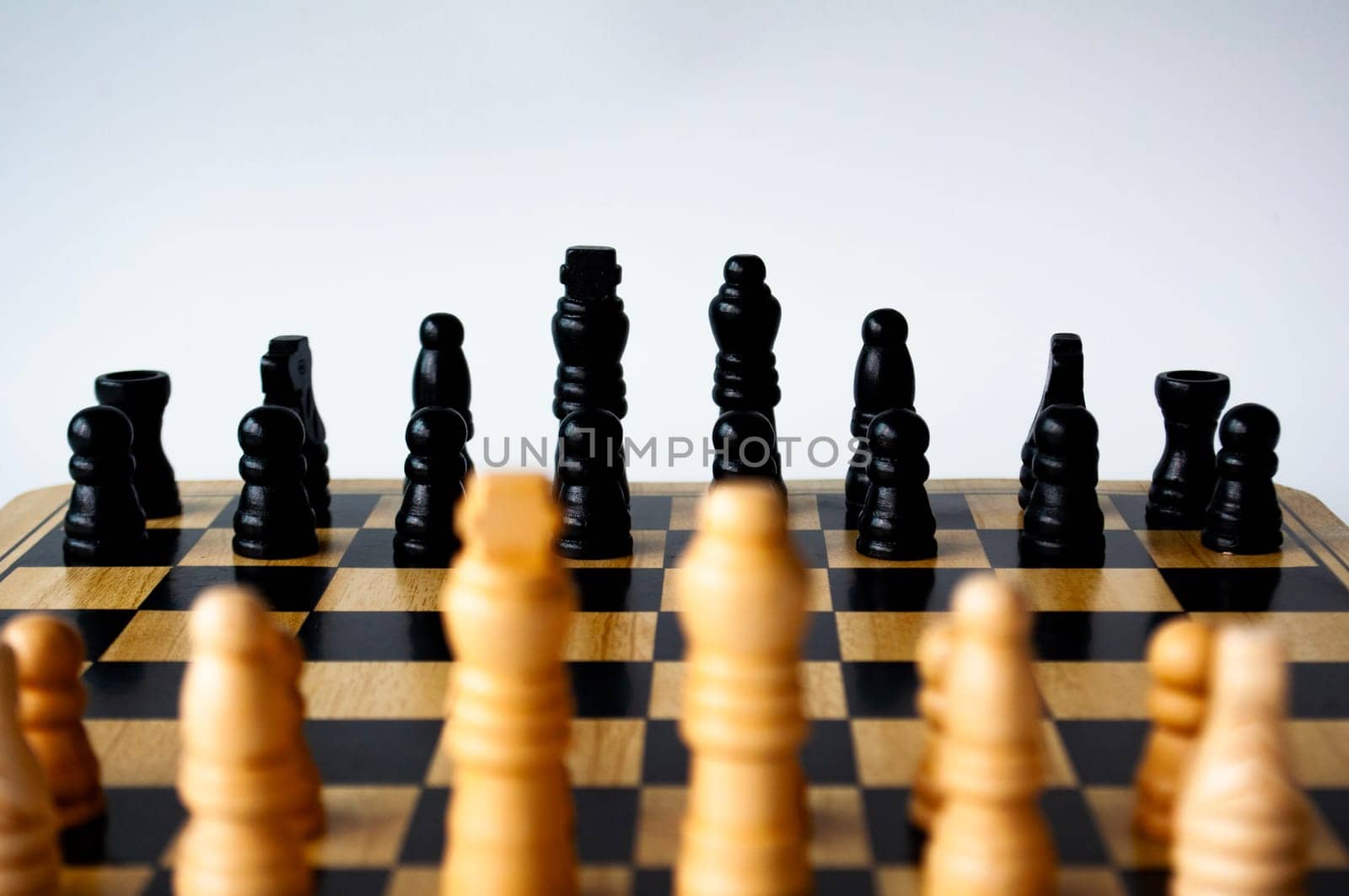 Selective view of chess pawn moving toward for battle. Strategy and tactic concept.