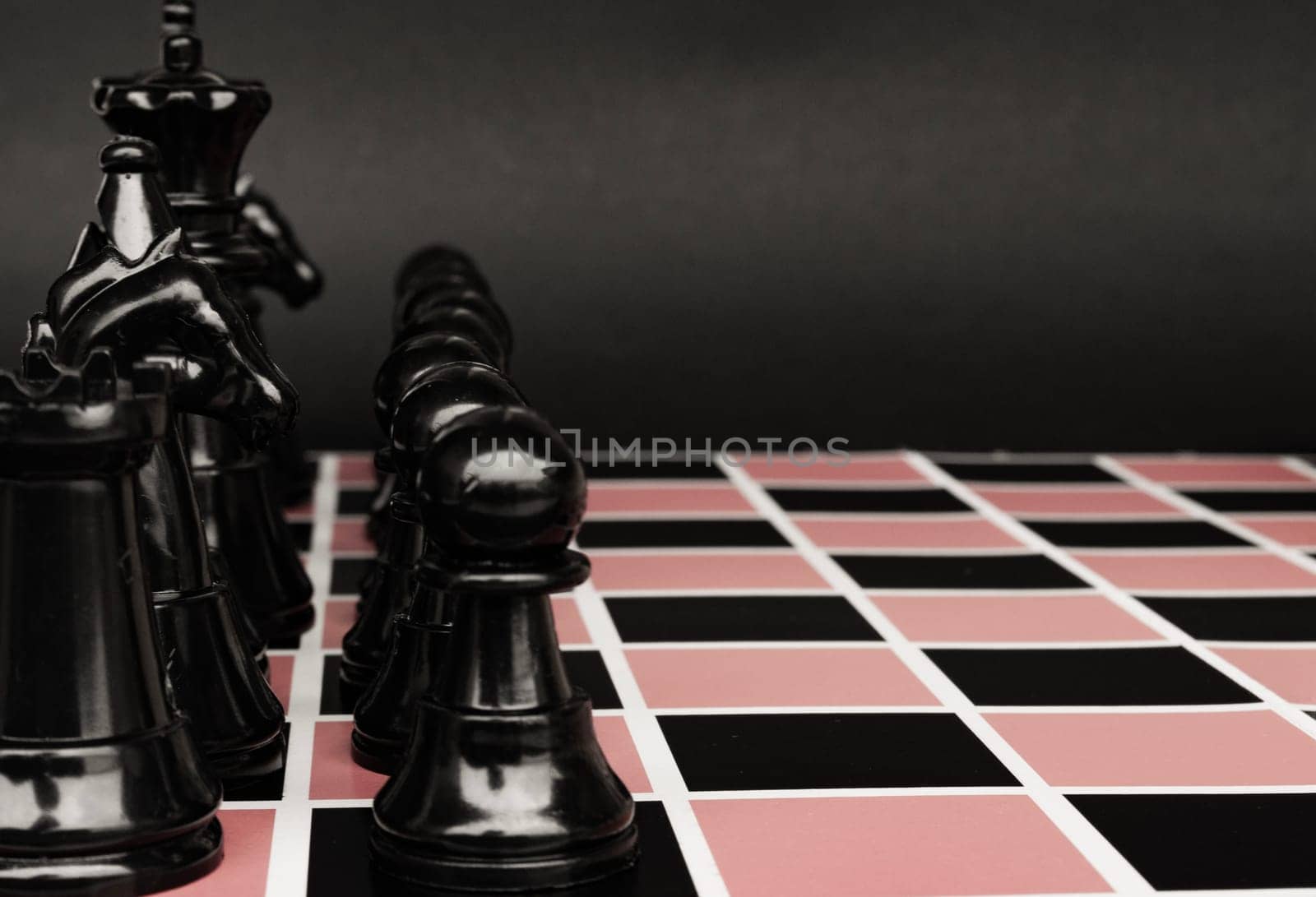Selective view of chess pawn moving toward for battle. Strategy and tactic concept.