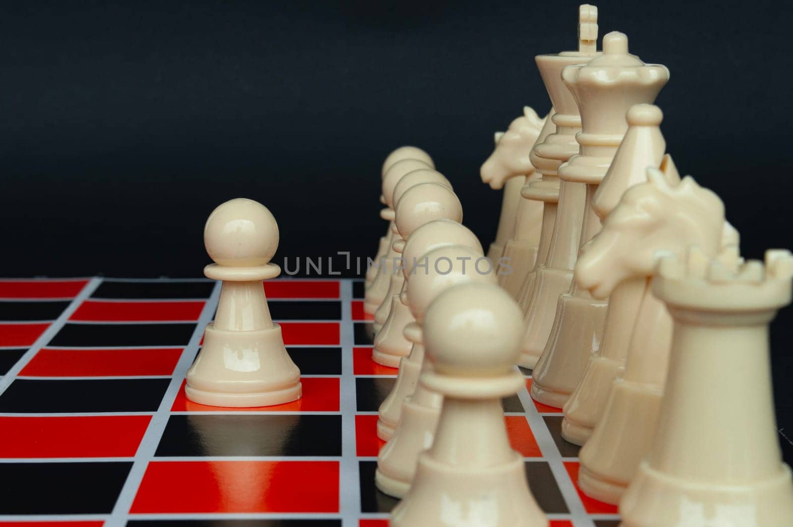 Selective view of chess pawn moving toward for battle. Strategy and tactic concept.