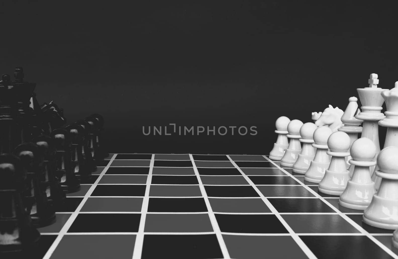 Selective view of chess pawn moving toward for battle. Strategy and tactic concept.