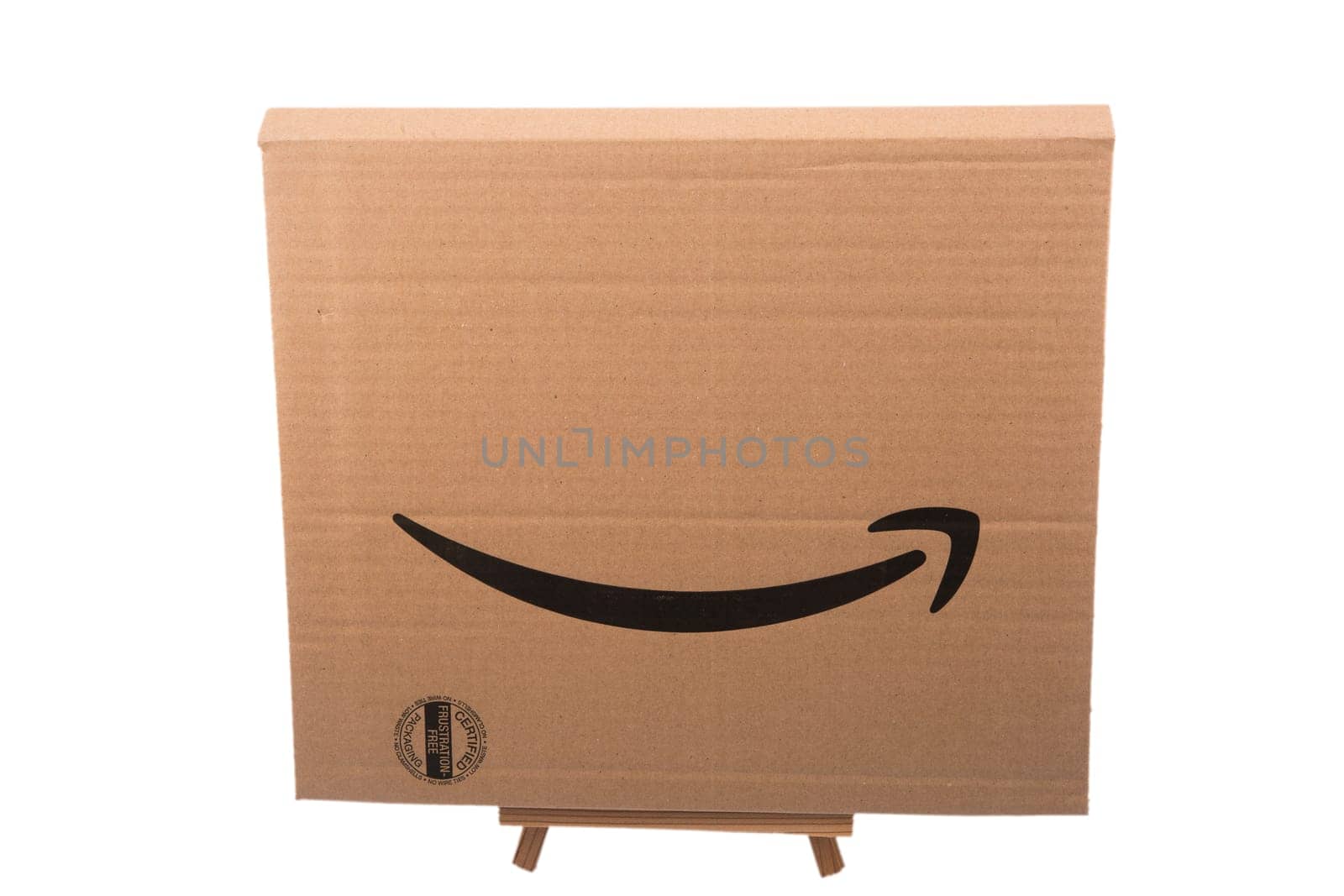HUETTENBERG, HESSE, GERMANY - 05-23-2023- Amazon arrow on cardboard. Amazon is an American electronic commerce and cloud computing company.