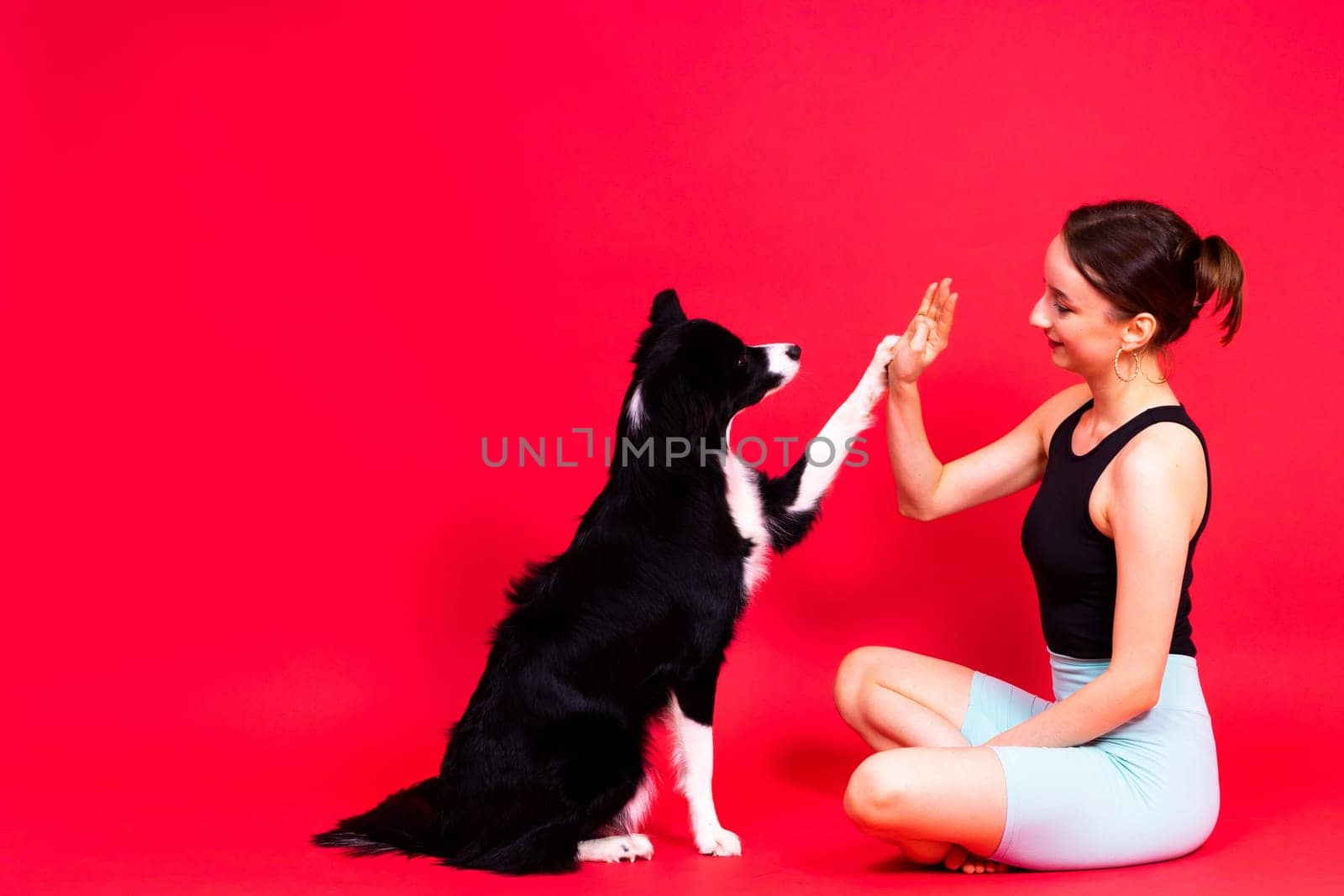 Friendship between people and animals, a studio shot, love, tender, warm feeling and emotion