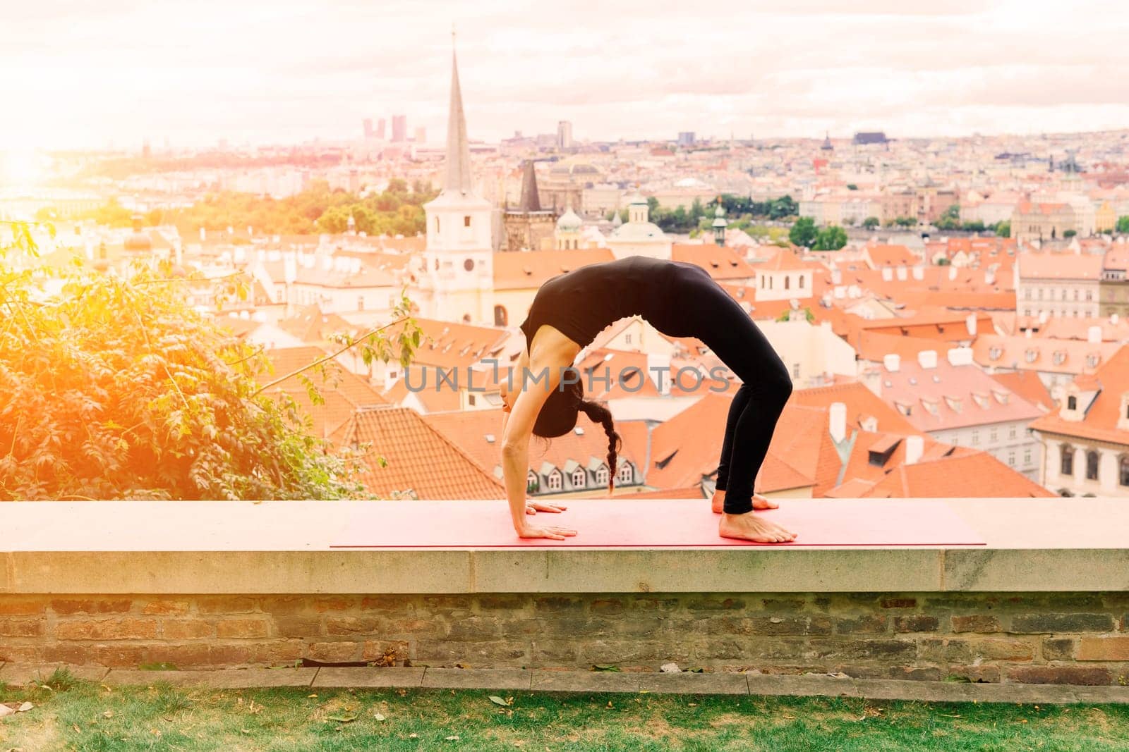 Mature asian woman doing yoga workout in a park. Concept of lifestyle fitness and healthy.