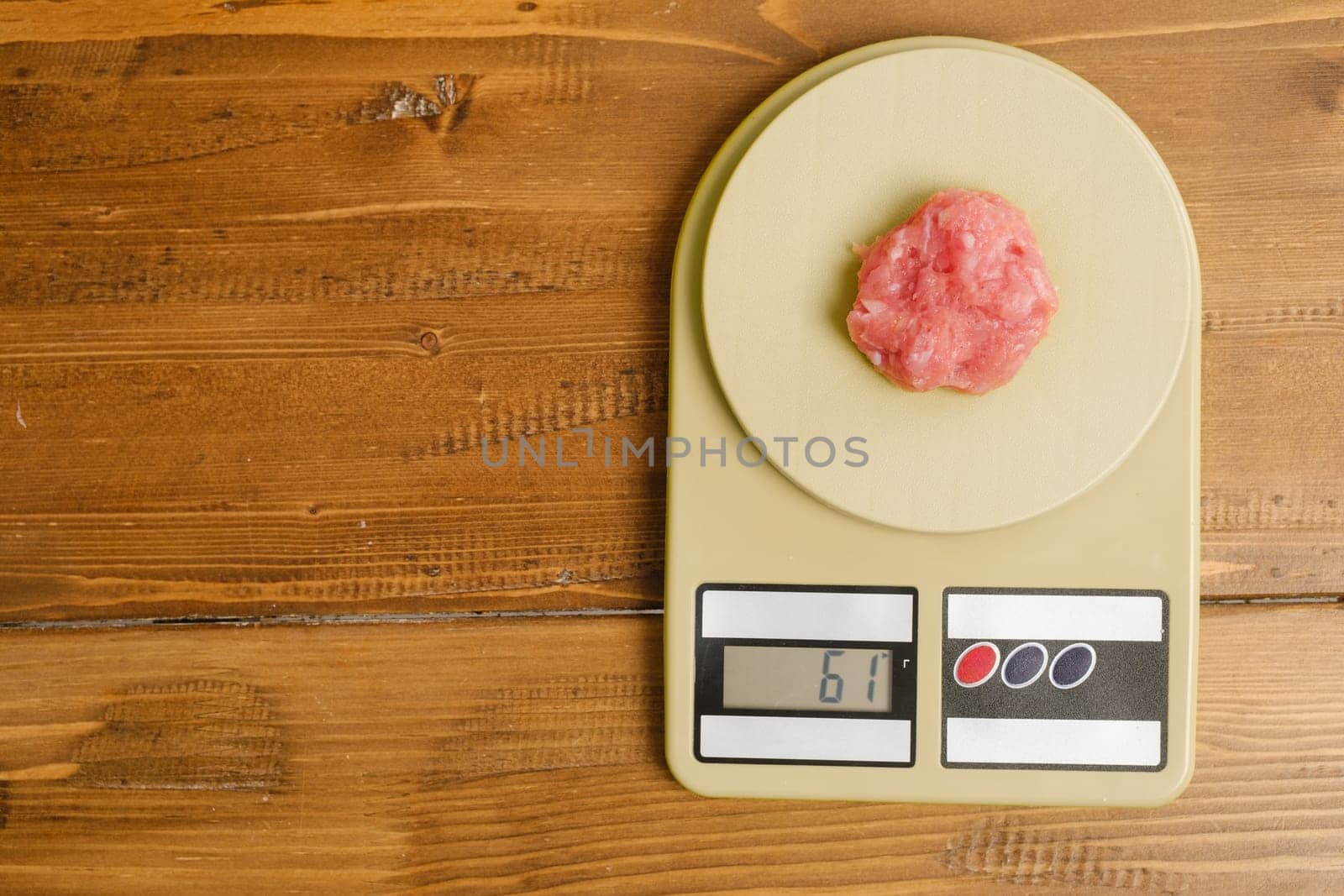 Top view of minced meat on a kitchen scales