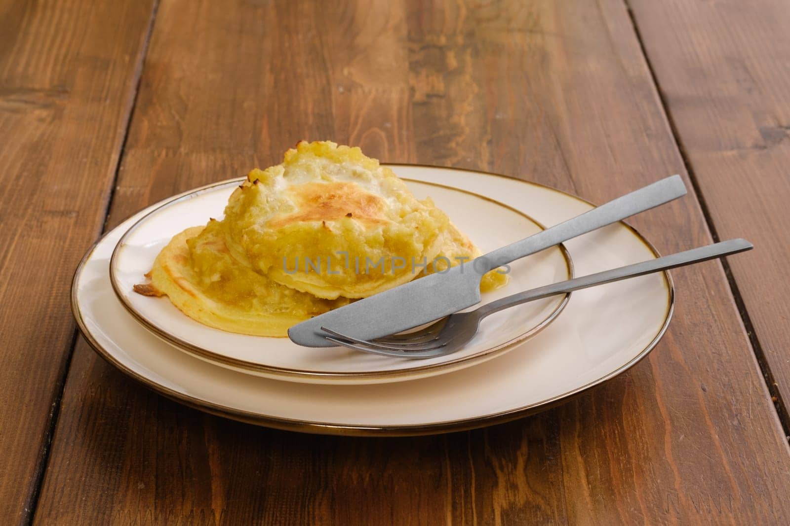 Portion of fried apple pancakes on a plate