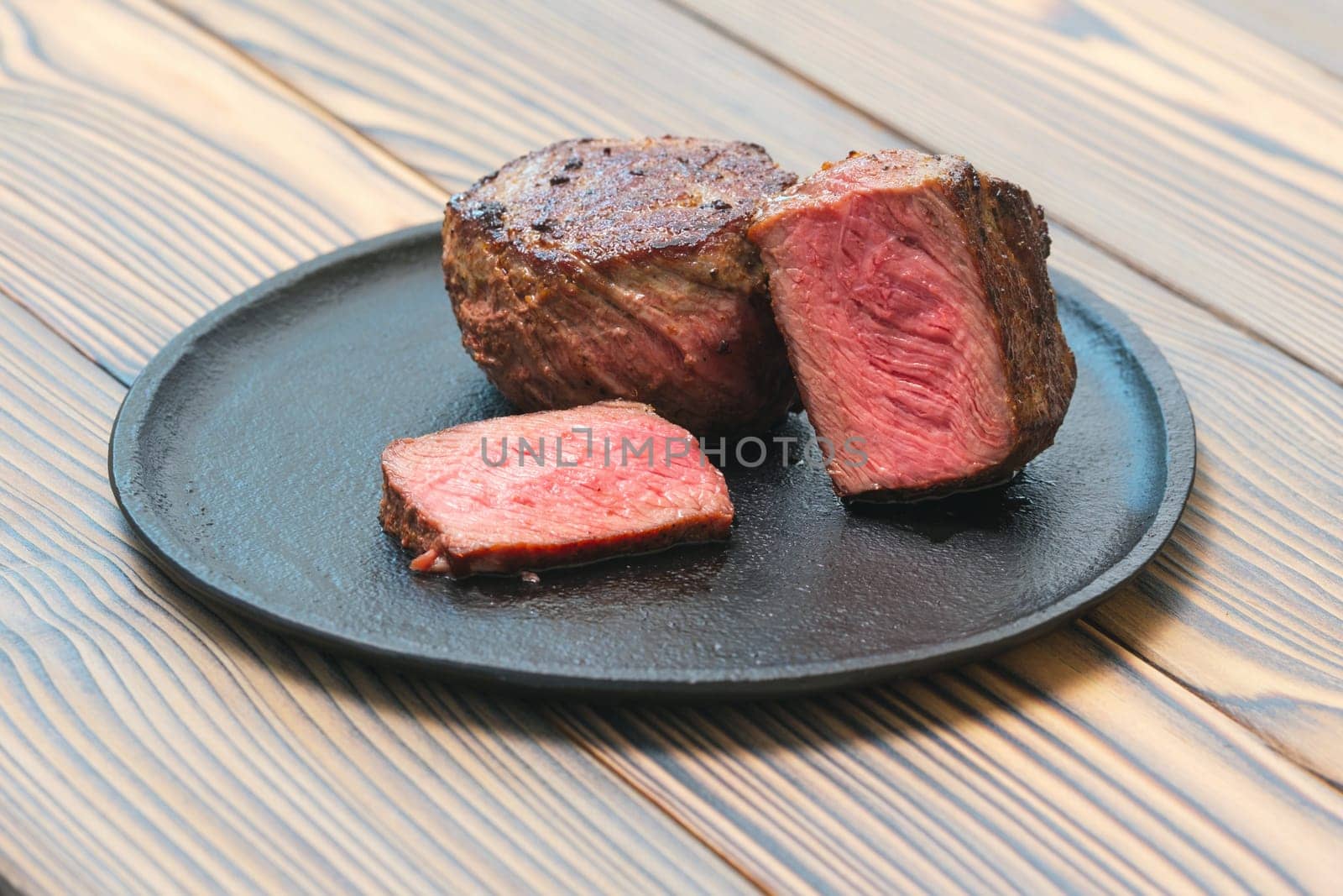 Pan seared fillet mignon on a plate