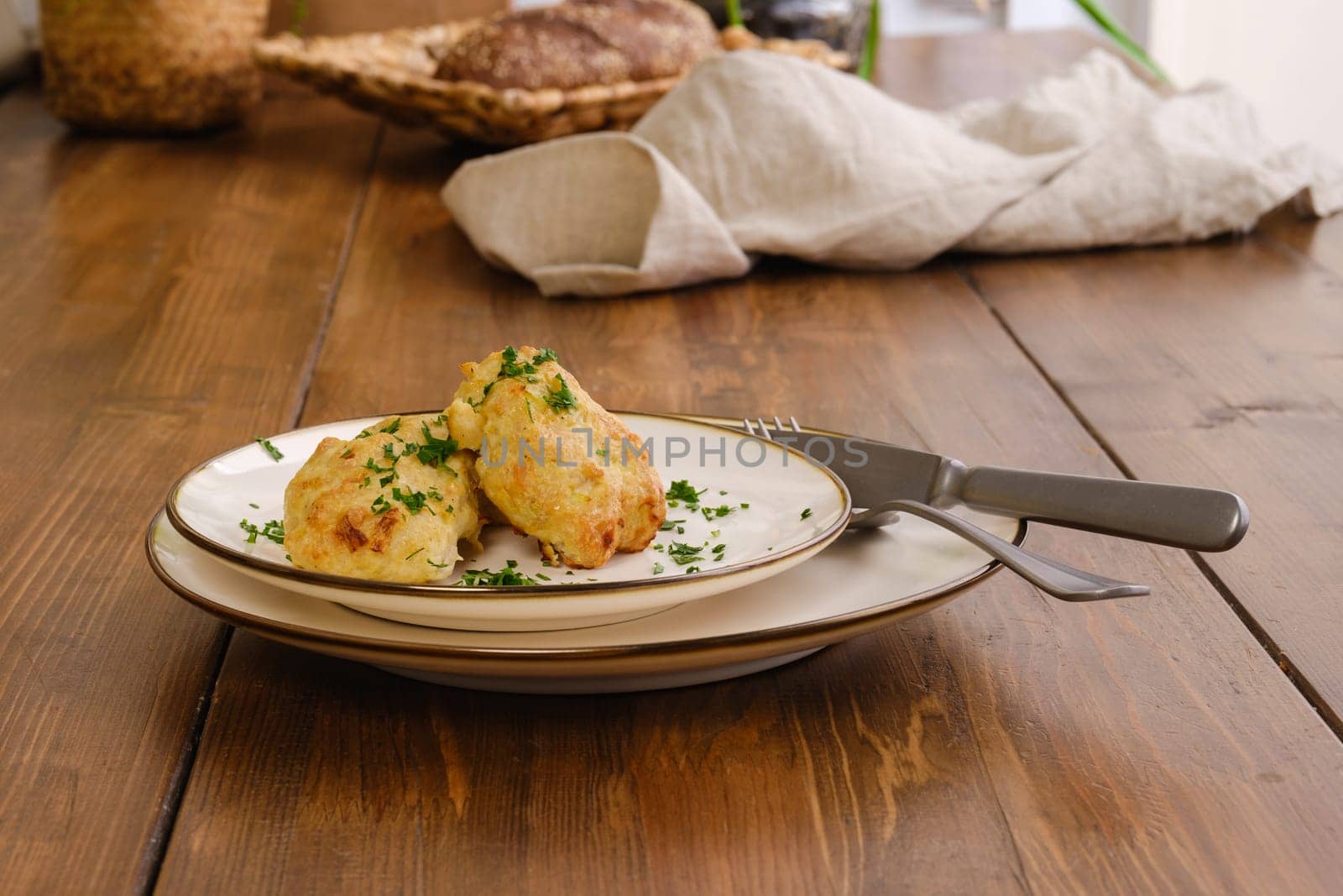 Dietary veal cutlets baked in oven on a plate