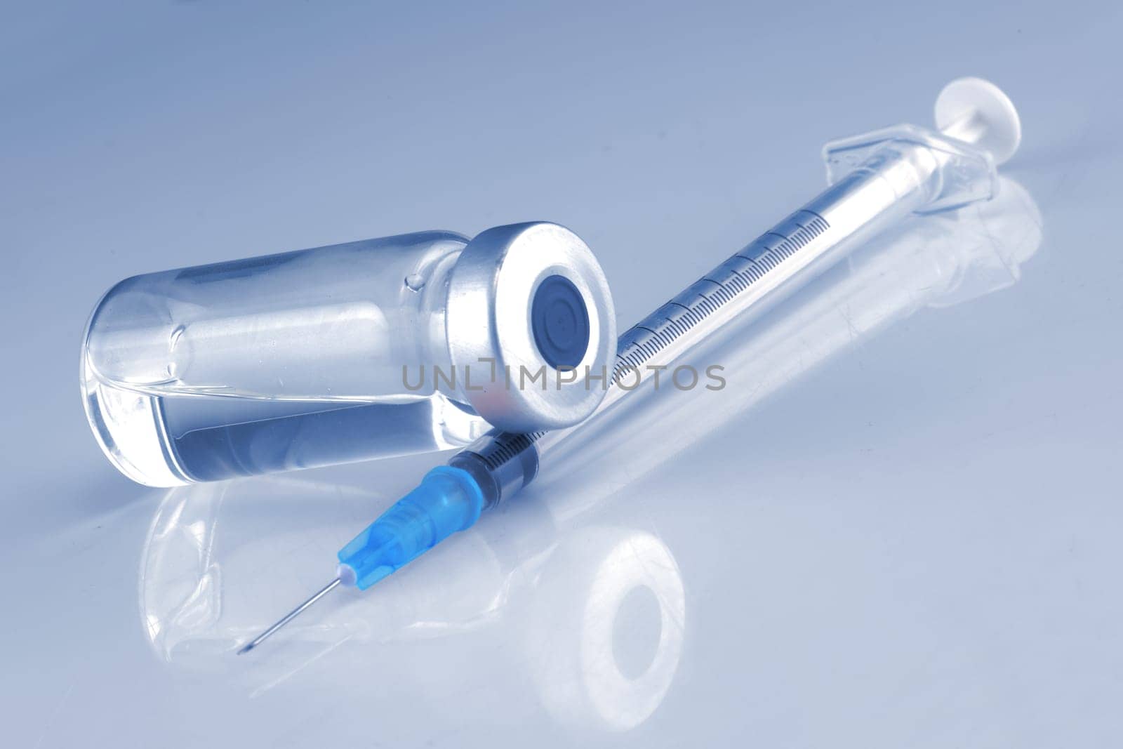 A medical syringe and an ampule bottle for vaccination