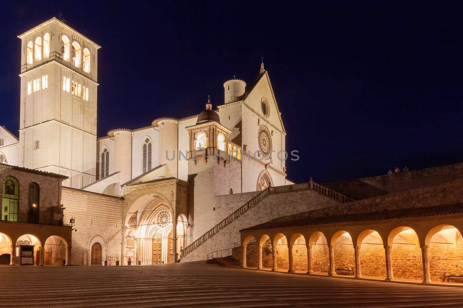 Night scene of empty Lower Square of St Francis in Assisi. Umbria. Italy.  Horizontally.