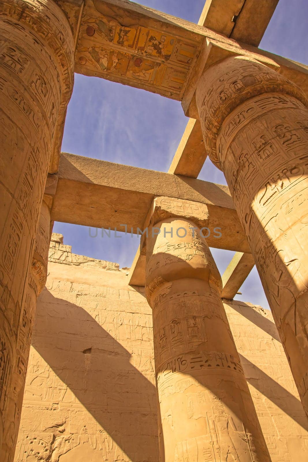 Great Hypostyle Hall and blue sky in the backgrouns at the Temples of Karnak (ancient Thebes). Luxor, Egypt.  Vertically.