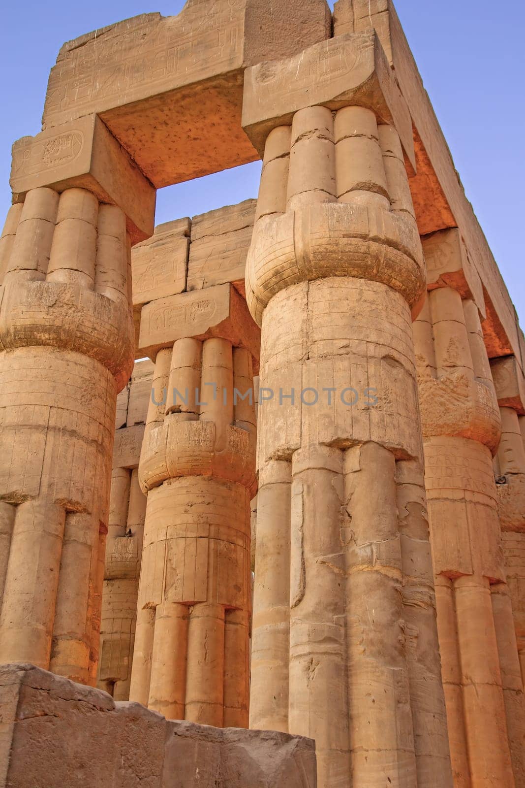 Columns with hieroglyphics at the Tample in Karnak. Luxor. Egypt. Vertically.