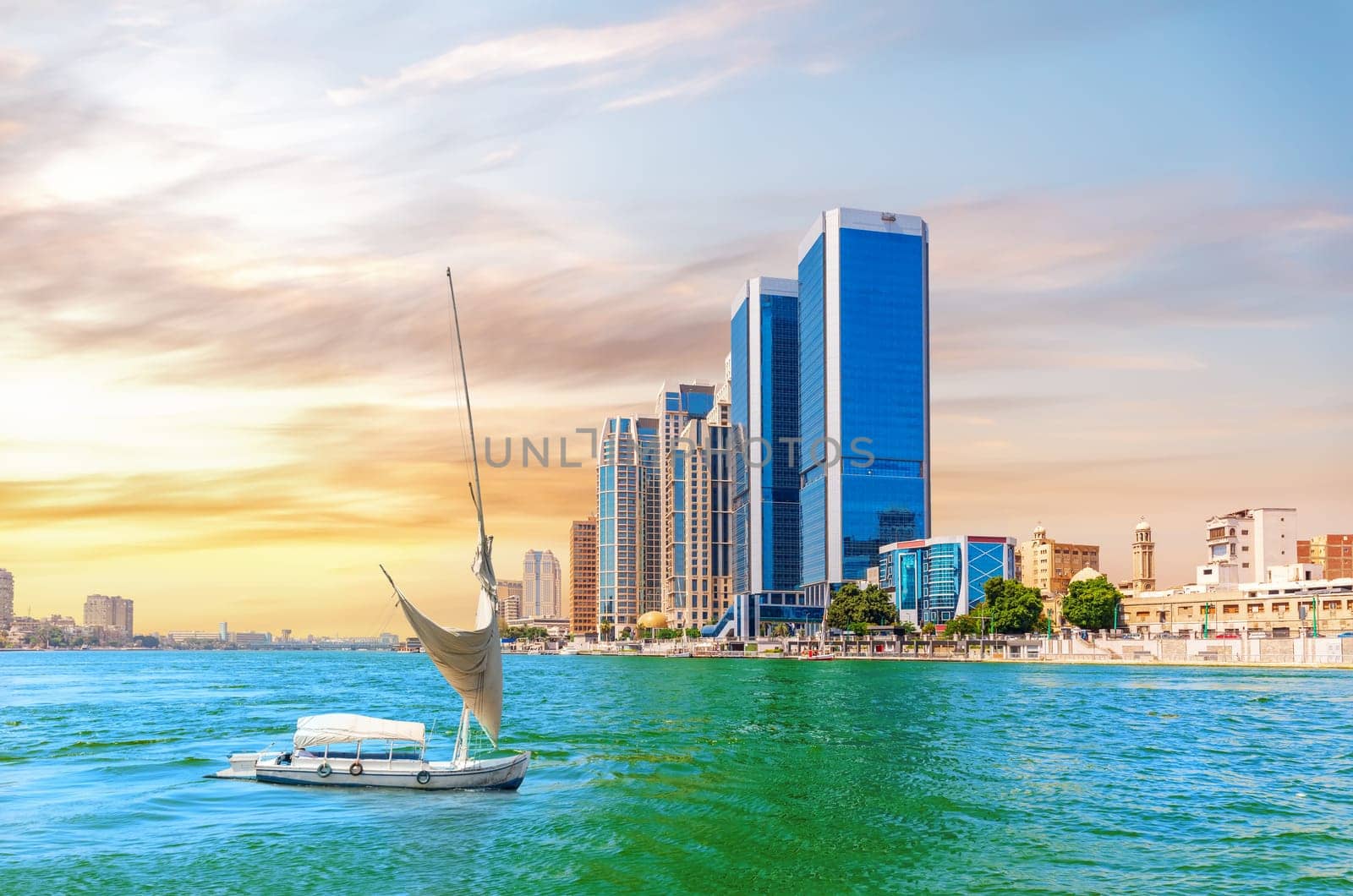 Beautiful view of the Nile river embankment with a yacht in the modern centre of Cairo, Egypt.