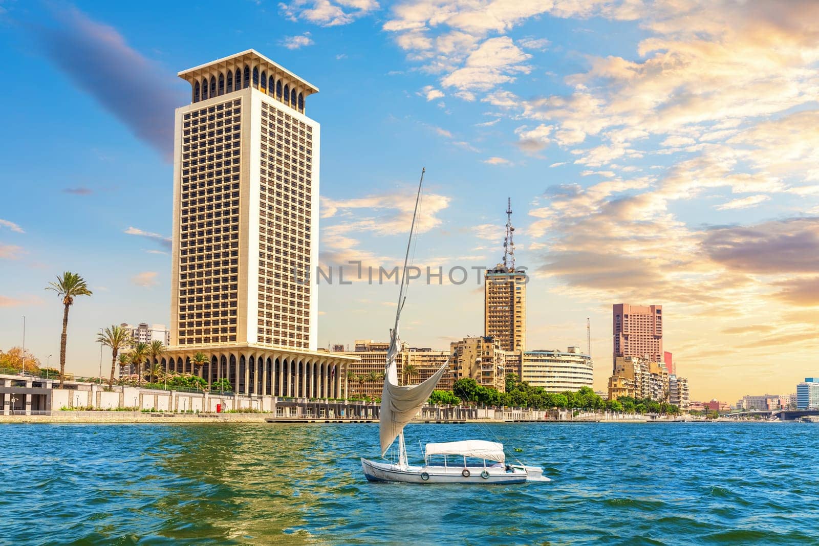 Sailboat iin the Great Nile river and the banks of Cairo, Egypt.