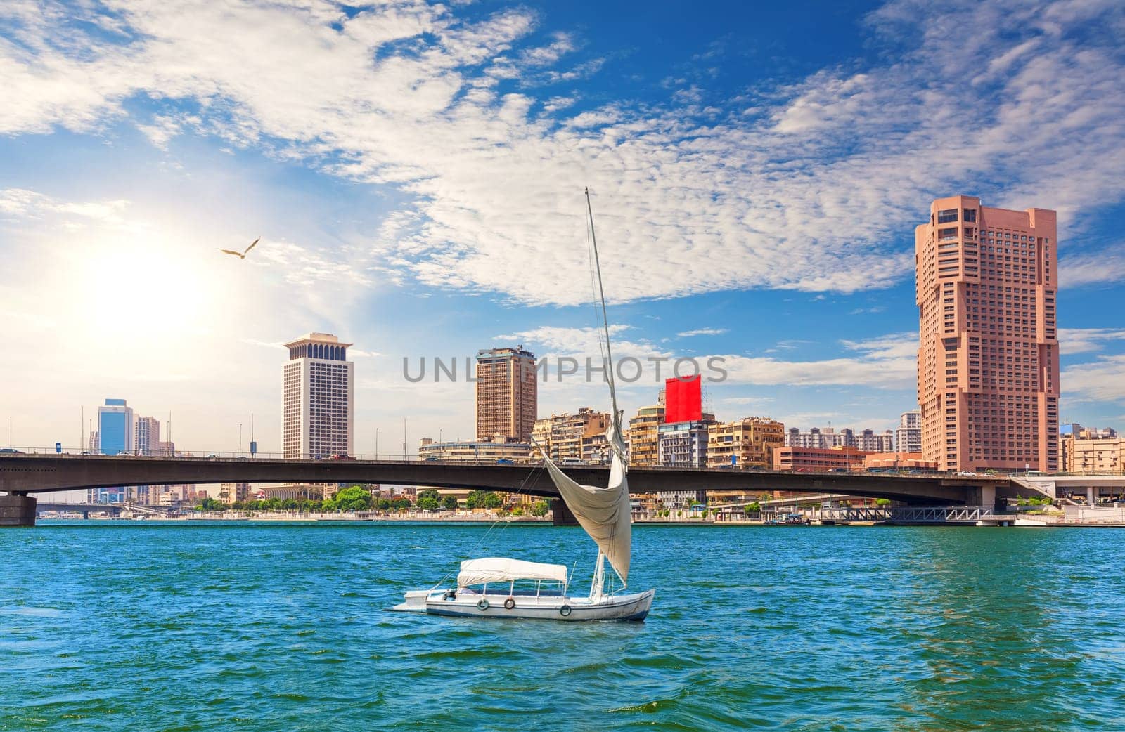 Bridge over the Nile, river board and fancy buildings of Cairo, beautiful day view, Egypt.