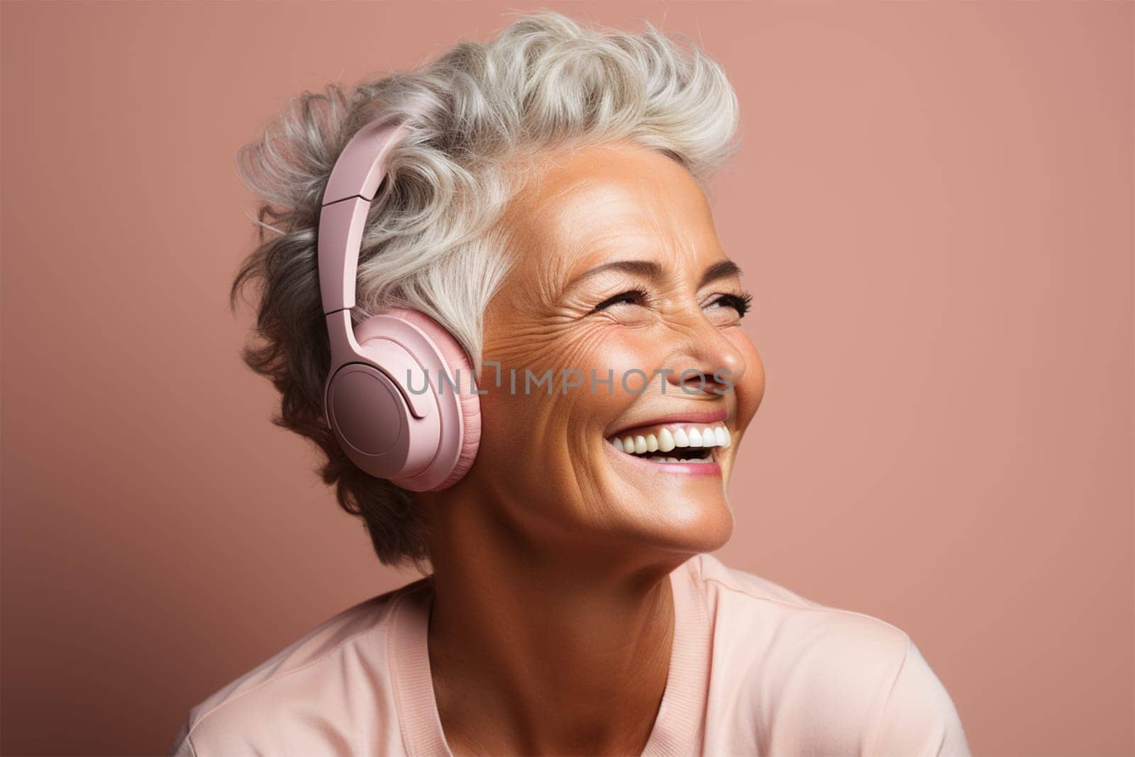 beautiful and cheerful gray-haired woman in pink clothes and headphones, on a color background.Generative AI