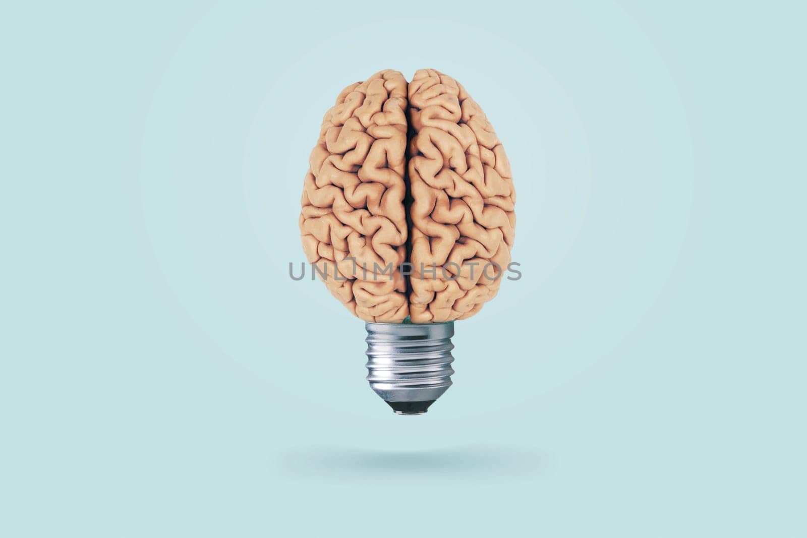 Creative light bulb brain on a light blue background. Brainstorm. Think differently, concept. Creative thinking. fresh thought