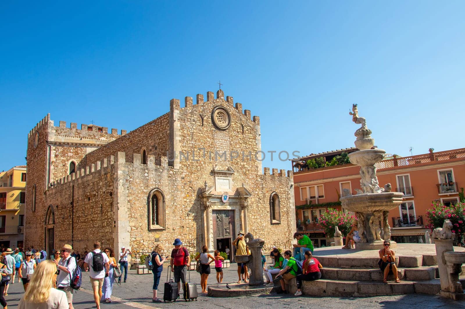 Sicily, Taormina, Italy - 28 September 2023. The Piazza del Duomo Taormina is a popular spot for both locals and visitors - you can rest on the steps of the fountain.