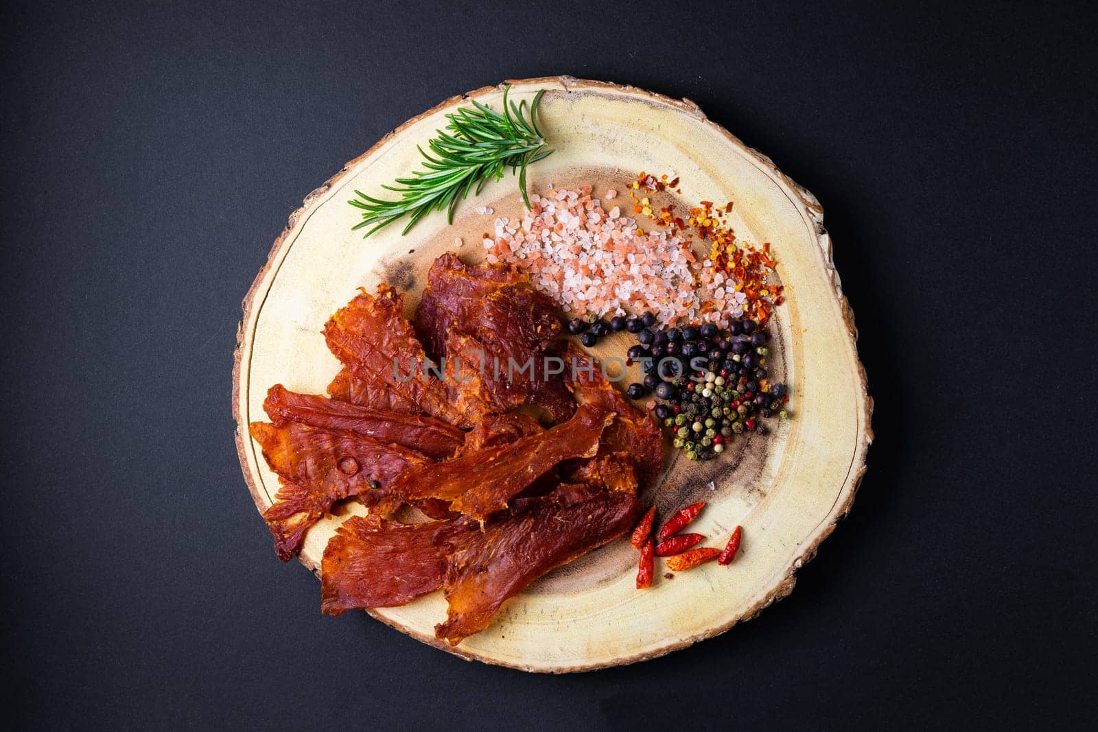 Beef jerky pieces isolated on white and black background