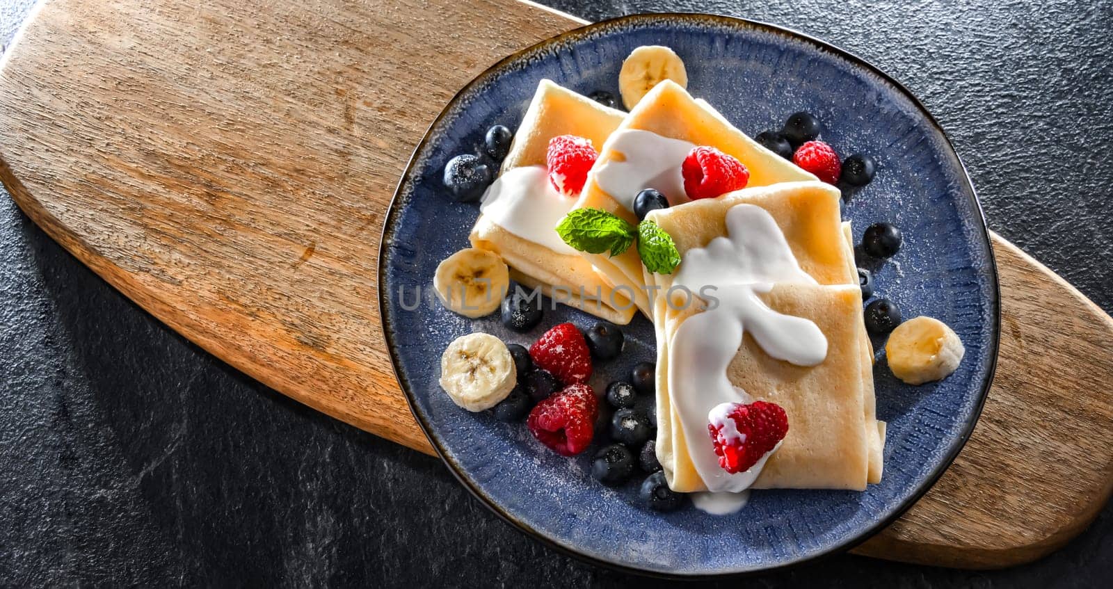 A plate of home-made Polish pancakes filled with sweet cottage cheese