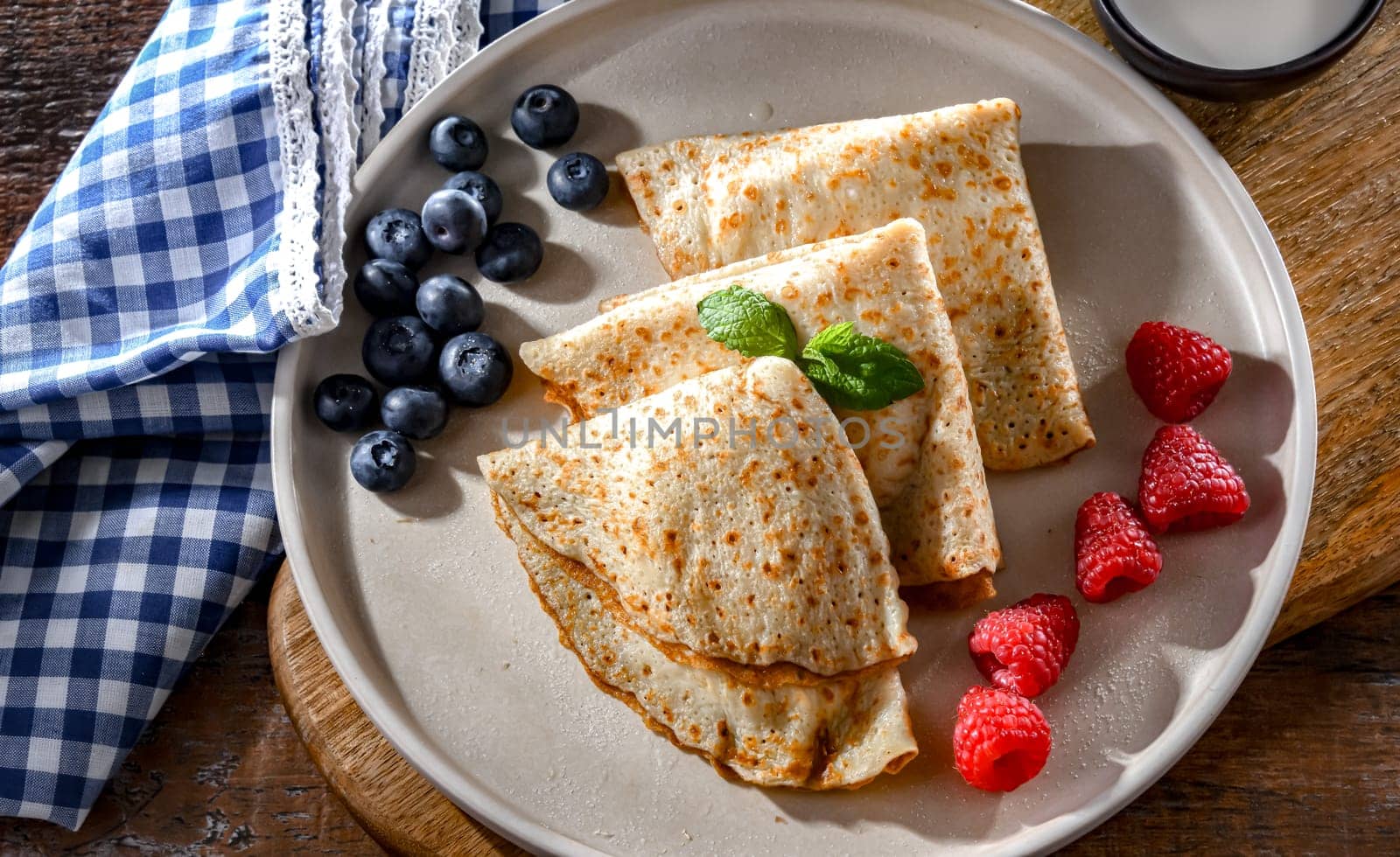 A plate of home-made Polish pancakes filled with sweet cottage cheese