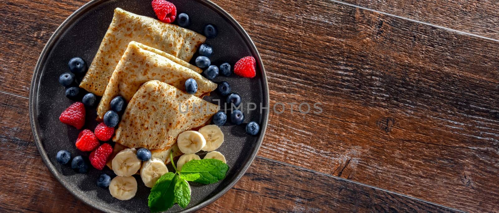 A plate of home-made Polish pancakes filled with sweet cottage cheese