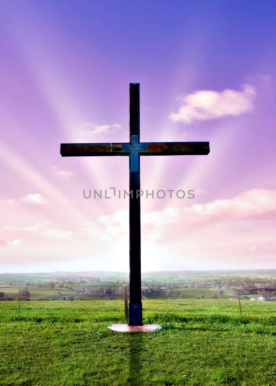 christian cross of christ at a beautfil pink sunset or sunrise