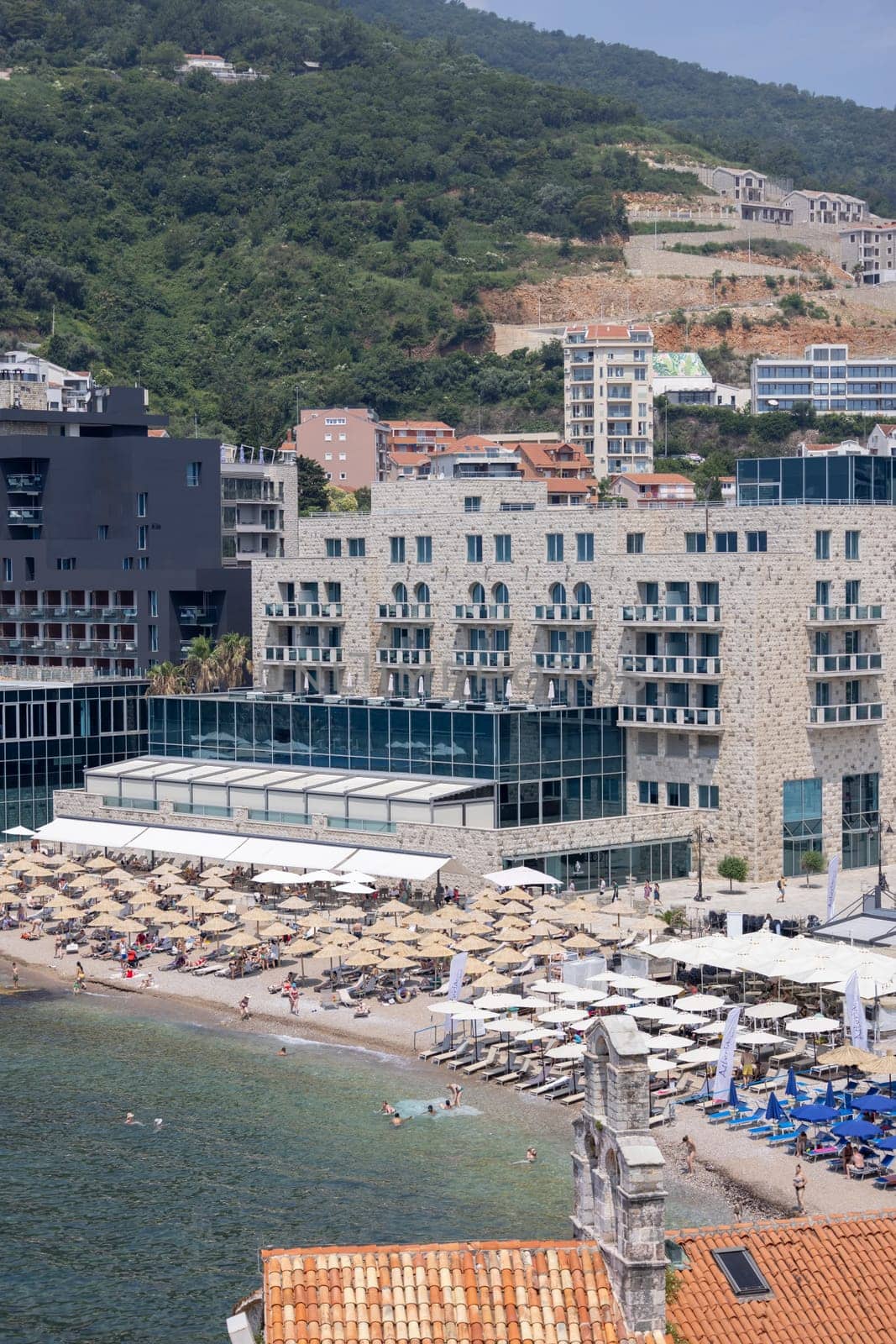 Budva, Montenegro - June 28, 2023: Aerial view from the Citadel of seaside by Adriatic Sea with Ricardova Glava Beach located at the City Walls