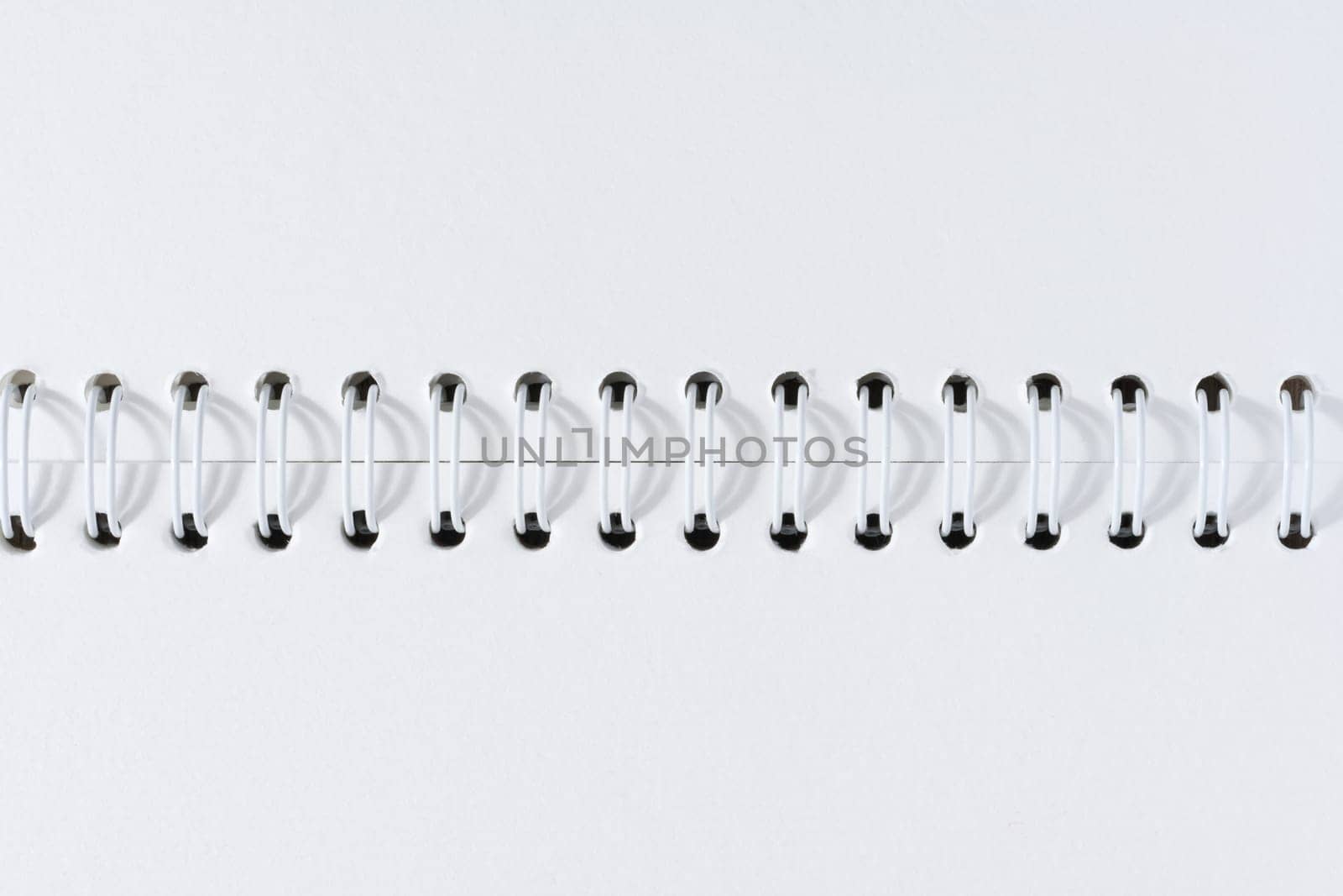 Open spiral notepad with blank white sheets