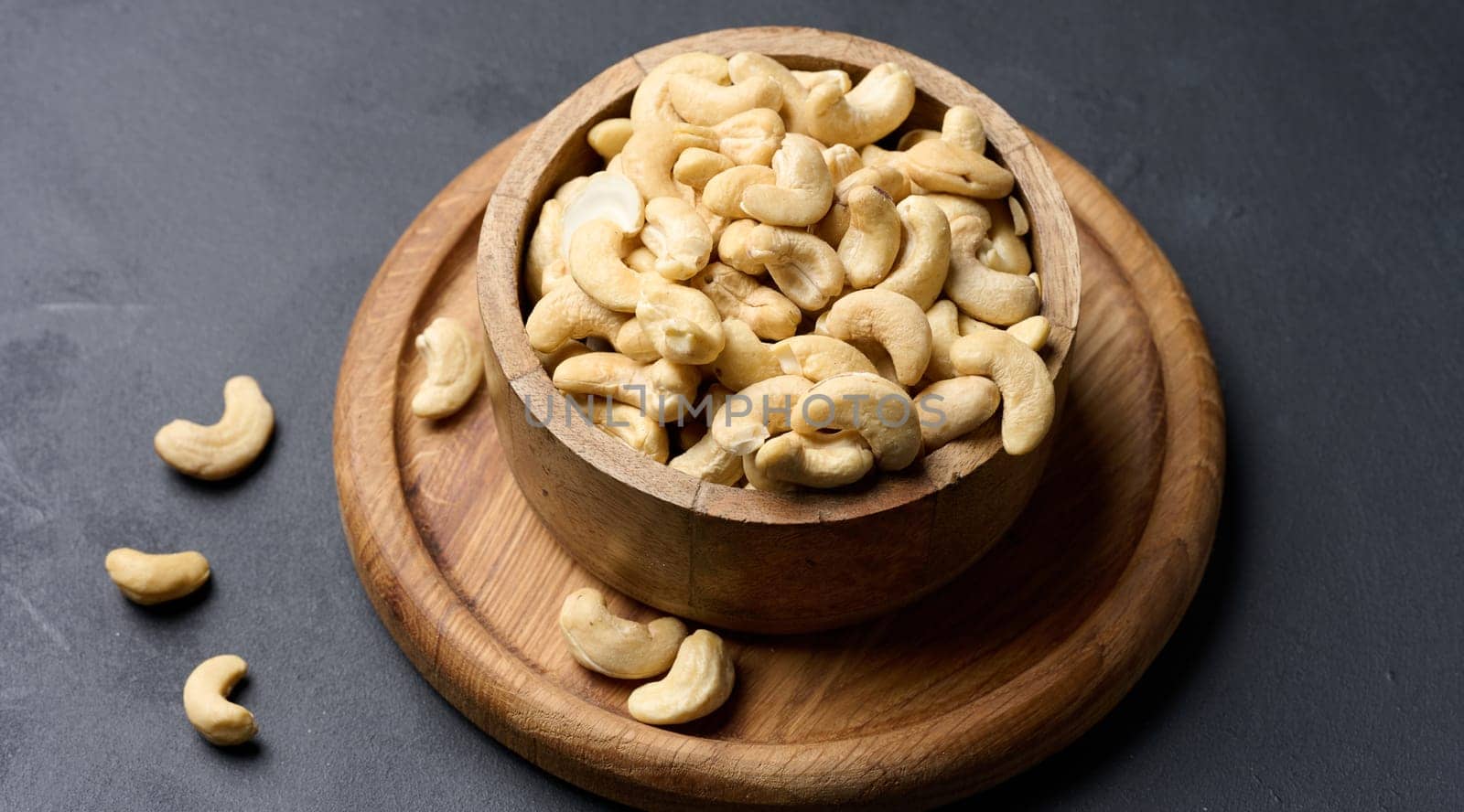 Cashews in a wooden bowl on the table