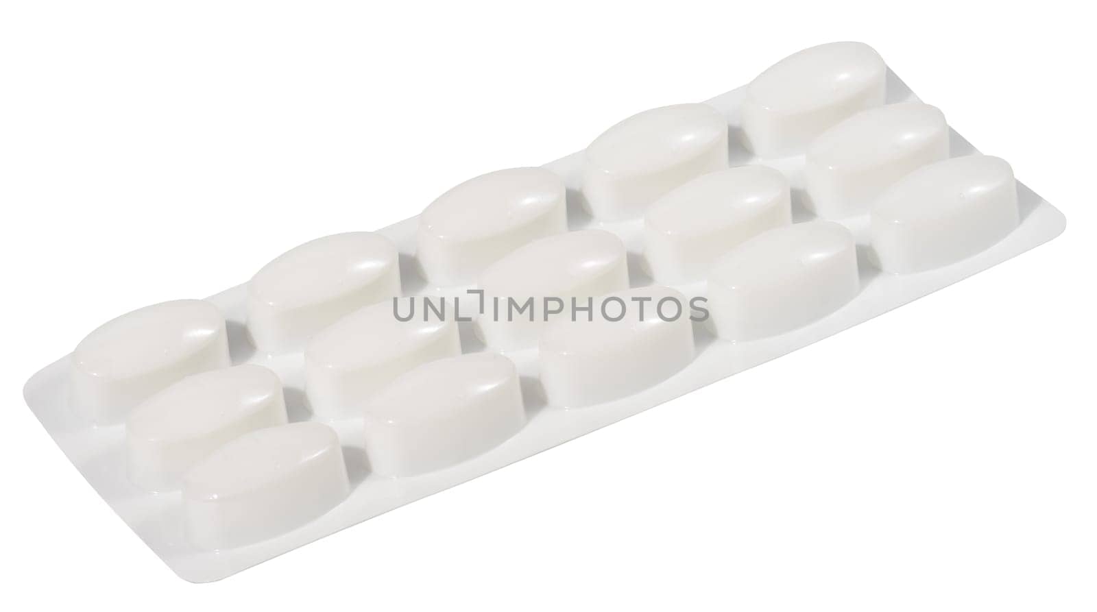 Oval tablets in white plastic packaging, close up